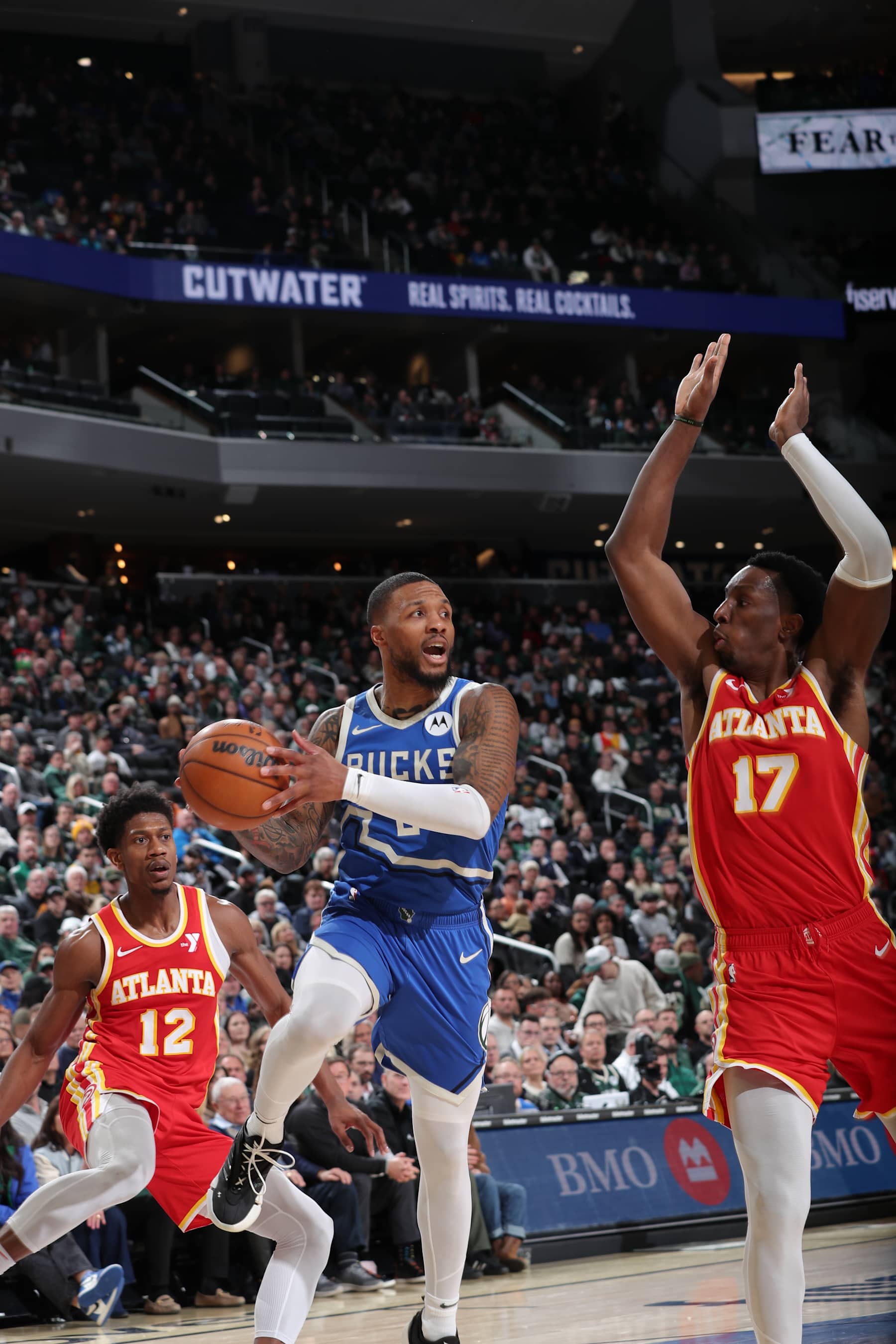 MILWAUKEE, WI - DECEMBER 4:   Damian Lillard #0 of the Milwaukee Bucks drives to the basket during the game against the Atlanta Hawks during a regular season game on December 4, 2024 at Fiserv Forum Center in Milwaukee, Wisconsin. NOTE TO USER: User expressly acknowledges and agrees that, by downloading and or using this Photograph, user is consenting to the terms and conditions of the Getty Images License Agreement. Mandatory Copyright Notice: Copyright 2024 NBAE (Photo by Gary Dineen/NBAE via Getty Images).