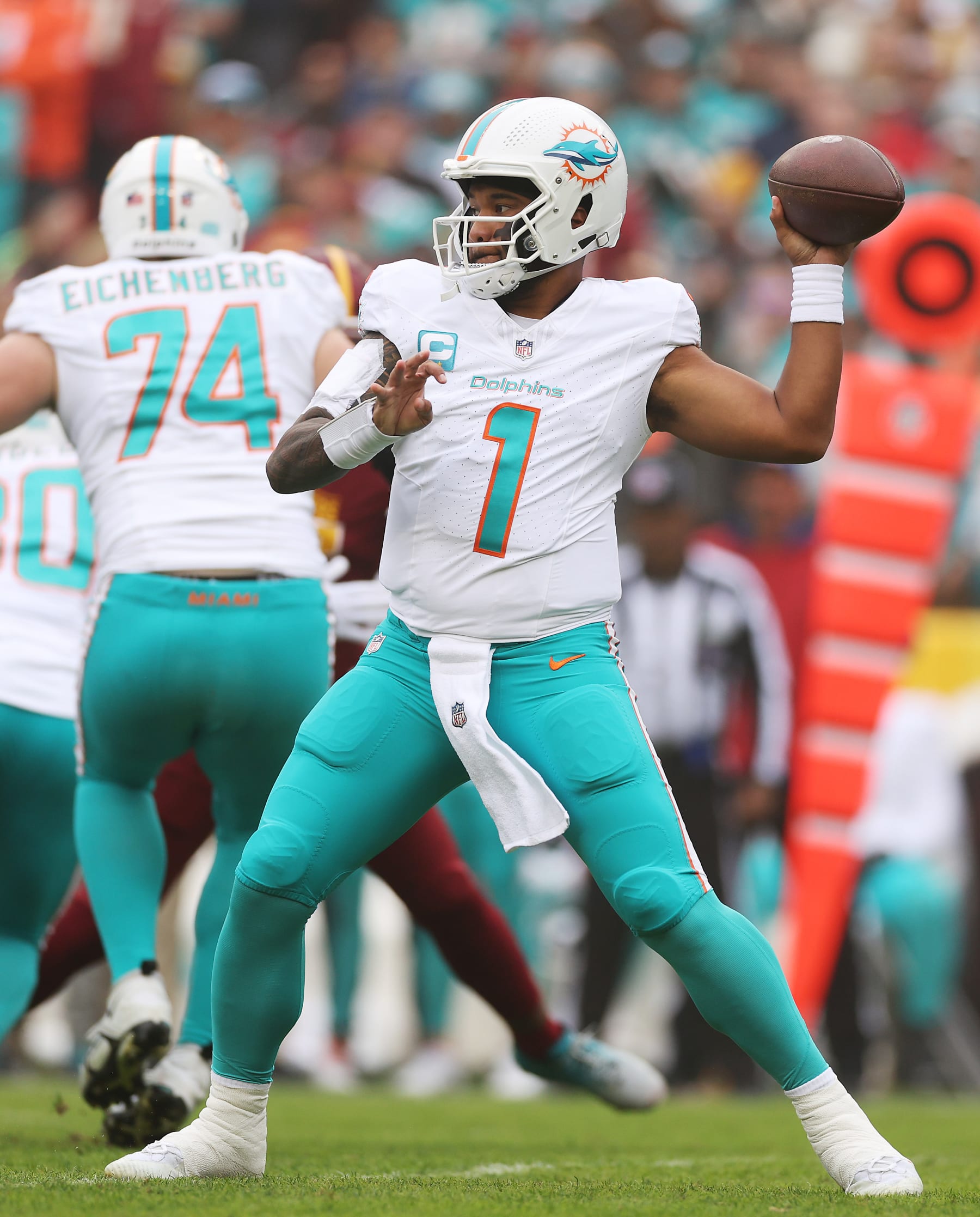 LANDOVER, MARYLAND - DECEMBER 03: Tua Tagovailoa #1 of the Miami Dolphins throws a pass against the Washington Commanders during the first half of the game at FedExField on December 03, 2023 in Landover, Maryland. (Photo by Patrick Smith/Getty Images)