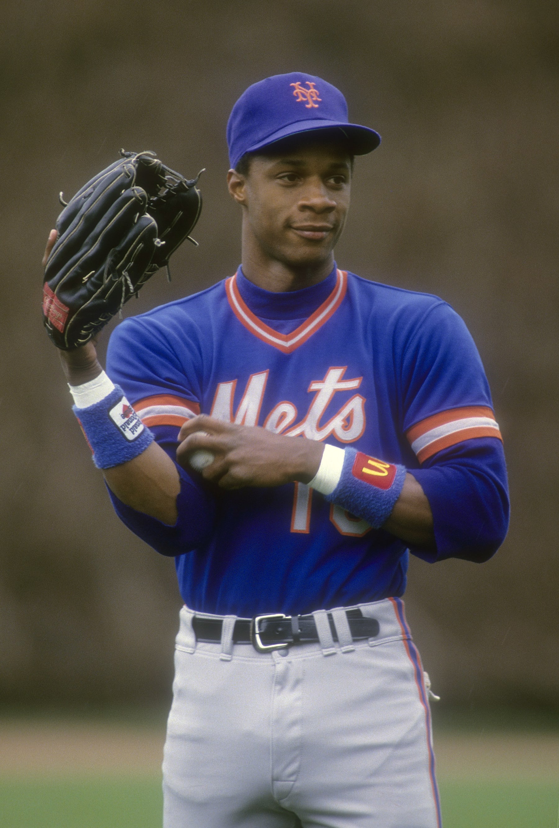 CHICAGO, IL - CIRCA 1988: Darryl Strawberry #18 of the New York Mets stands in the outfield before a Major League Baseball game against the Chicago Cubs circa 1988 at Wrigley Field in Chicago, Illinois. Strawberry played for the Mets from 1983-90. (Photo by Focus on Sport/Getty Images)