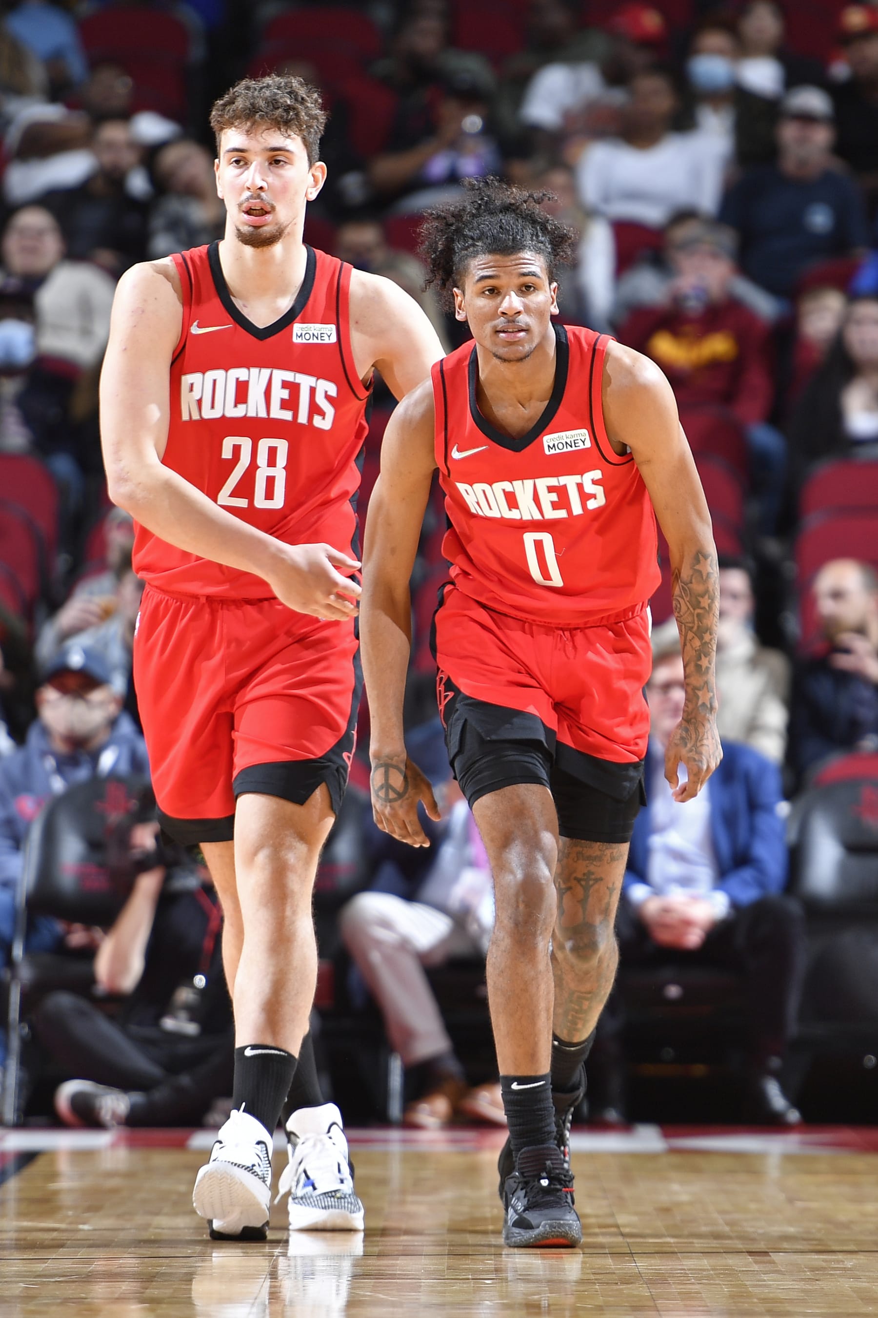 HOUSTON, TX - FEBRUARY 02: Alperen Sengun #28 and  Jalen Green #0 of the Houston Rockets looks on during the game against the Cleveland Cavaliers  on February 2, 2022 at the Toyota Center in Houston, Texas. NOTE TO USER: User expressly acknowledges and agrees that, by downloading and or using this photograph, User is consenting to the terms and conditions of the Getty Images License Agreement. Mandatory Copyright Notice: Copyright 2022 NBAE (Photo by Logan Riely/NBAE via Getty Images)