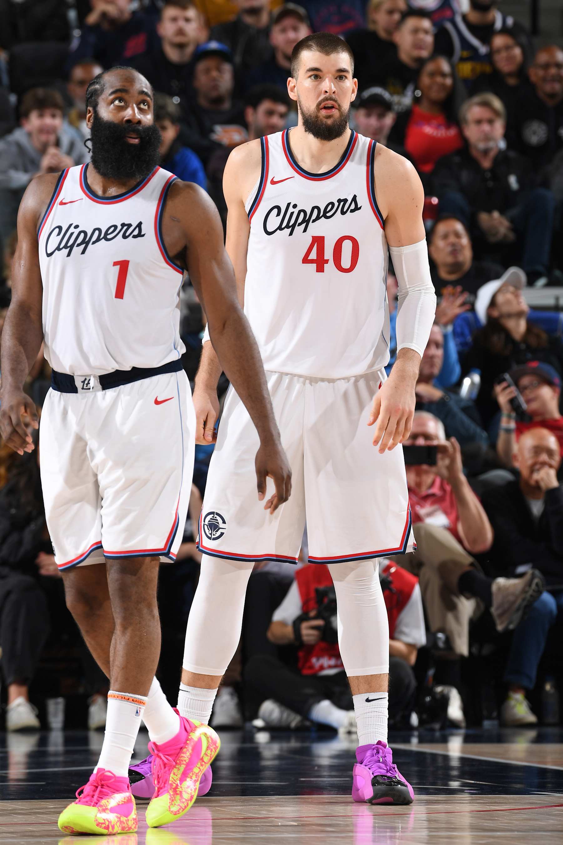 INGLEWOOD, CA - DECEMBER 1: James Harden #1 and Ivica Zubac #40 of the LA Clippers look on during the game against the Denver Nuggets on December 1, 2024 at Intuit Dome in Los Angeles, California. NOTE TO USER: User expressly acknowledges and agrees that, by downloading and/or using this Photograph, user is consenting to the terms and conditions of the Getty Images License Agreement. Mandatory Copyright Notice: Copyright 2024 NBAE (Photo by Juan Ocampo/NBAE via Getty Images)