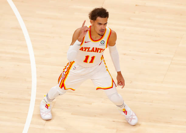 ATLANTA, GA - APRIL 06: Trae Young #11 of the Atlanta Hawks reacts during the first half against the New Orleans Pelicans at State Farm Arena on April 6, 2021 in Atlanta, Georgia. NOTE TO USER: User expressly acknowledges and agrees that, by downloading and/or using this photograph, user is consenting to the terms and conditions of the Getty Images License Agreement. (Photo by Todd Kirkland/Getty Images)