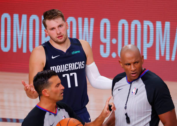 LAKE BUENA VISTA, FLORIDA - AUGUST 23: Luka Doncic #77 of the Dallas Mavericks reacts to referee Zach Zarba #15 and referee Kevin Cutler #34 during the third quarter against the LA Clippers in Game Four of the Western Conference First Round during the 2020 NBA Playoffs at AdventHealth Arena at ESPN Wide World Of Sports Complex on August 23, 2020 in Lake Buena Vista, Florida. NOTE TO USER: User expressly acknowledges and agrees that, by downloading and or using this photograph, User is consenting to the terms and conditions of the Getty Images License Agreement.  (Photo by Kevin C. Cox/Getty Images)