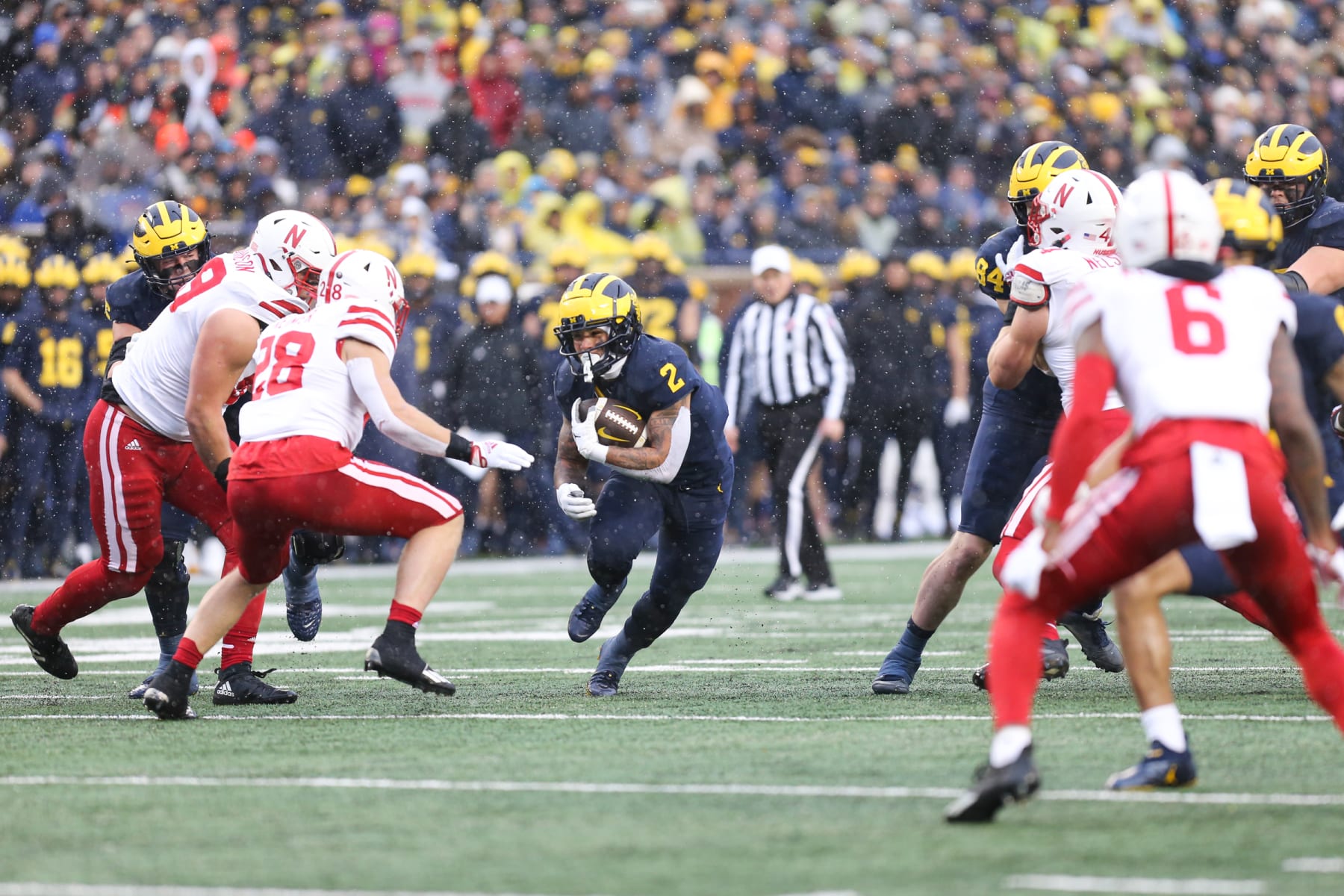 ANN ARBOR, MI - NOVEMBER 12:  Michigan Wolverines running back Blake Corum (2) runs with the ball through an opening  in the line during a regular season Big Ten Conference college football game between the Nebraska Cornhuskers and the Michigan Wolverines on November 12, 2022 at Michigan Stadium in Ann Arbor, Michigan.  (Photo by Scott W. Grau/Icon Sportswire via Getty Images)