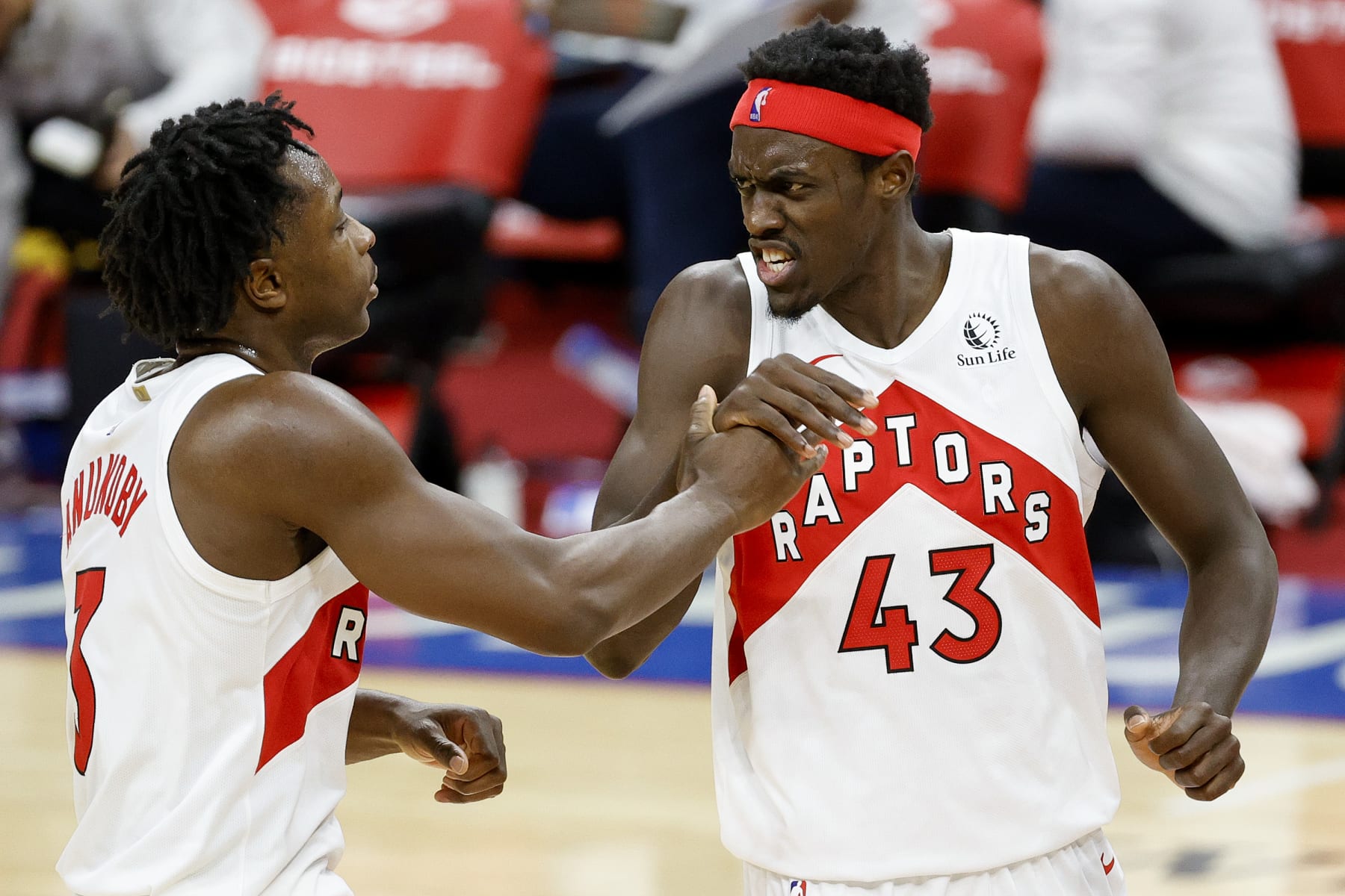 PHILADELPHIA, PENNSYLVANIA - DECEMBER 29: Pascal Siakam #43 of the Toronto Raptors celebrates a basket with OG Anunoby #3 during the third quarter against the Philadelphia 76ers at Wells Fargo Center on December 29, 2020 in Philadelphia, Pennsylvania. NOTE TO USER: User expressly acknowledges and agrees that, by downloading and or using this photograph, User is consenting to the terms and conditions of the Getty Images License Agreement. (Photo by Tim Nwachukwu/Getty Images)