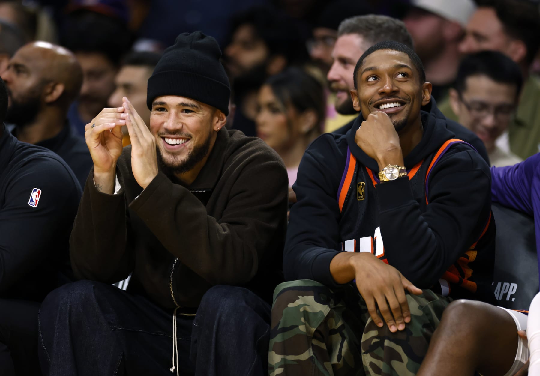 LOS ANGELES, CALIFORNIA - OCTOBER 26: Devin Booker #1 and Bradley Beal #3 of the Phoenix Suns follow the action from the bench during the first half against Los Angeles Lakers at Crypto.com Arena on October 26, 2023 in Los Angeles, California. NOTE TO USER: User expressly acknowledges and agrees that, by downloading and or using this photograph, User is consenting to the terms and conditions of the Getty Images License Agreement. (Photo by Kevork Djansezian/Getty Images)