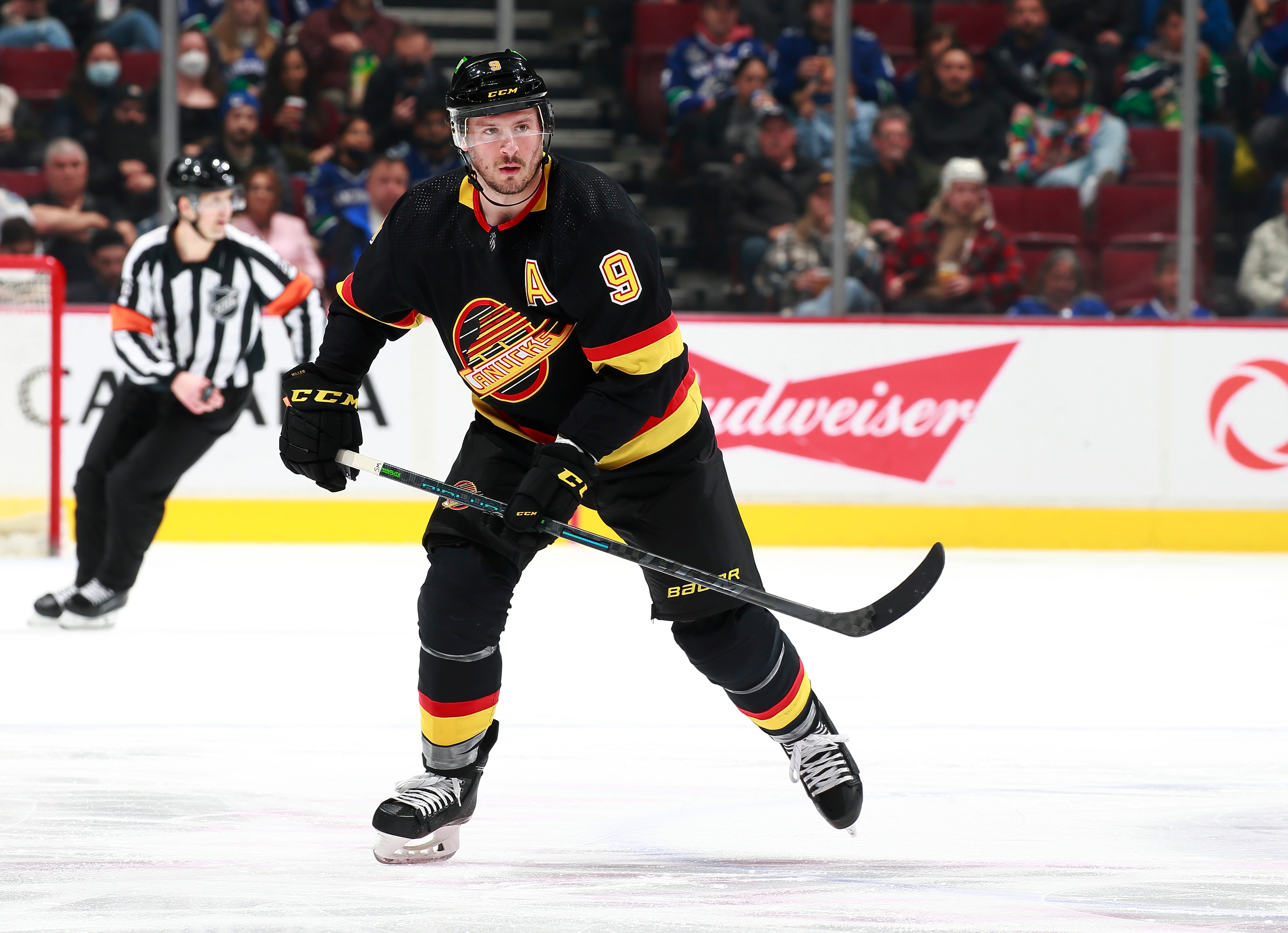 VANCOUVER, BC - APRIL 26: J.T. Miller #9 of the Vancouver Canucks skates up ice during their NHL game against the Seattle Kraken at Rogers Arena April 26, 2022 in Vancouver, British Columbia, Canada.  (Photo by Jeff Vinnick/NHLI via Getty Images)"n