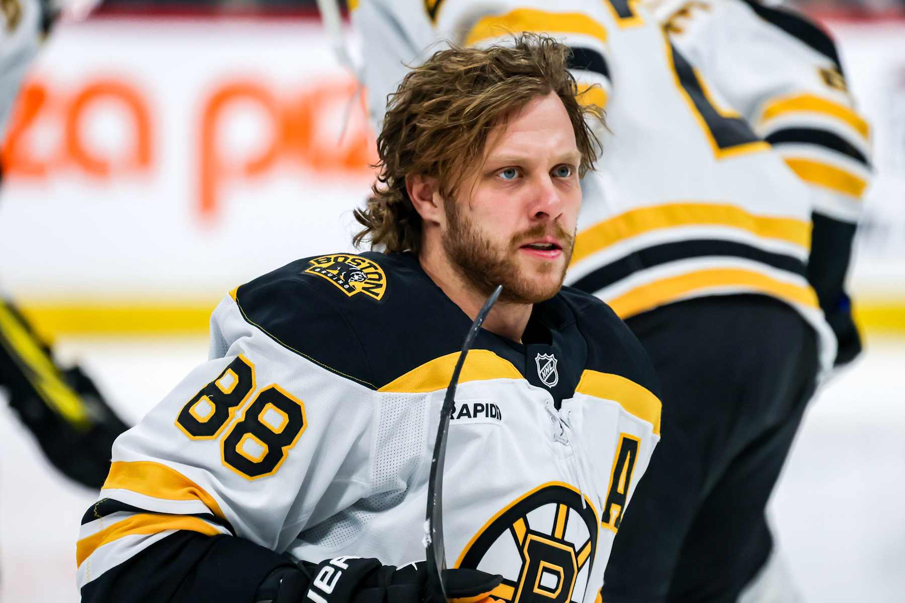 WINNIPEG, CANADA - DECEMBER 10: David Pastrnak #88 of the Boston Bruins looks on during the pre-game warm up prior to NHL action against the Winnipeg Jets at the Canada Life Centre on December 10, 2024 in Winnipeg, Manitoba, Canada. (Photo by Jonathan Kozub/NHLI via Getty Images)