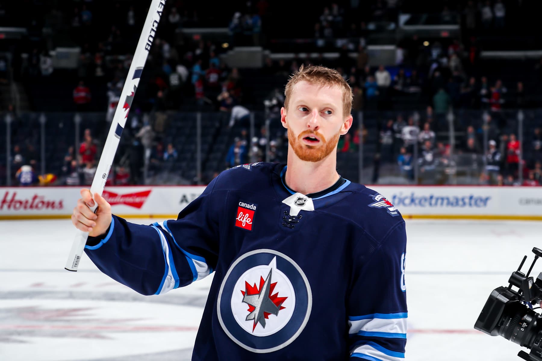 WINNIPEG, CANADA - DECEMBER 14: Kyle Connor #81 of the Winnipeg Jets salutes the fans after receiving second star honours following a 4-2 victory over the Montreal Canadiens at the Canada Life Centre on December 14, 2024 in Winnipeg, Manitoba, Canada. (Photo by Darcy Finley/NHLI via Getty Images)
