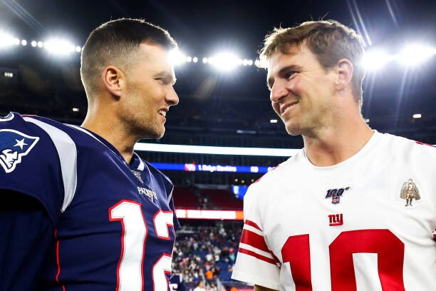 FOXBOROUGH, MA - AUGUST 29:   Tom Brady #12 of the New England Patriots greets Eli Manning #10 of the New York Giants after a preseason game at Gillette Stadium on August 29, 2019 in Foxborough, Massachusetts.  (Photo by Adam Glanzman/Getty Images)