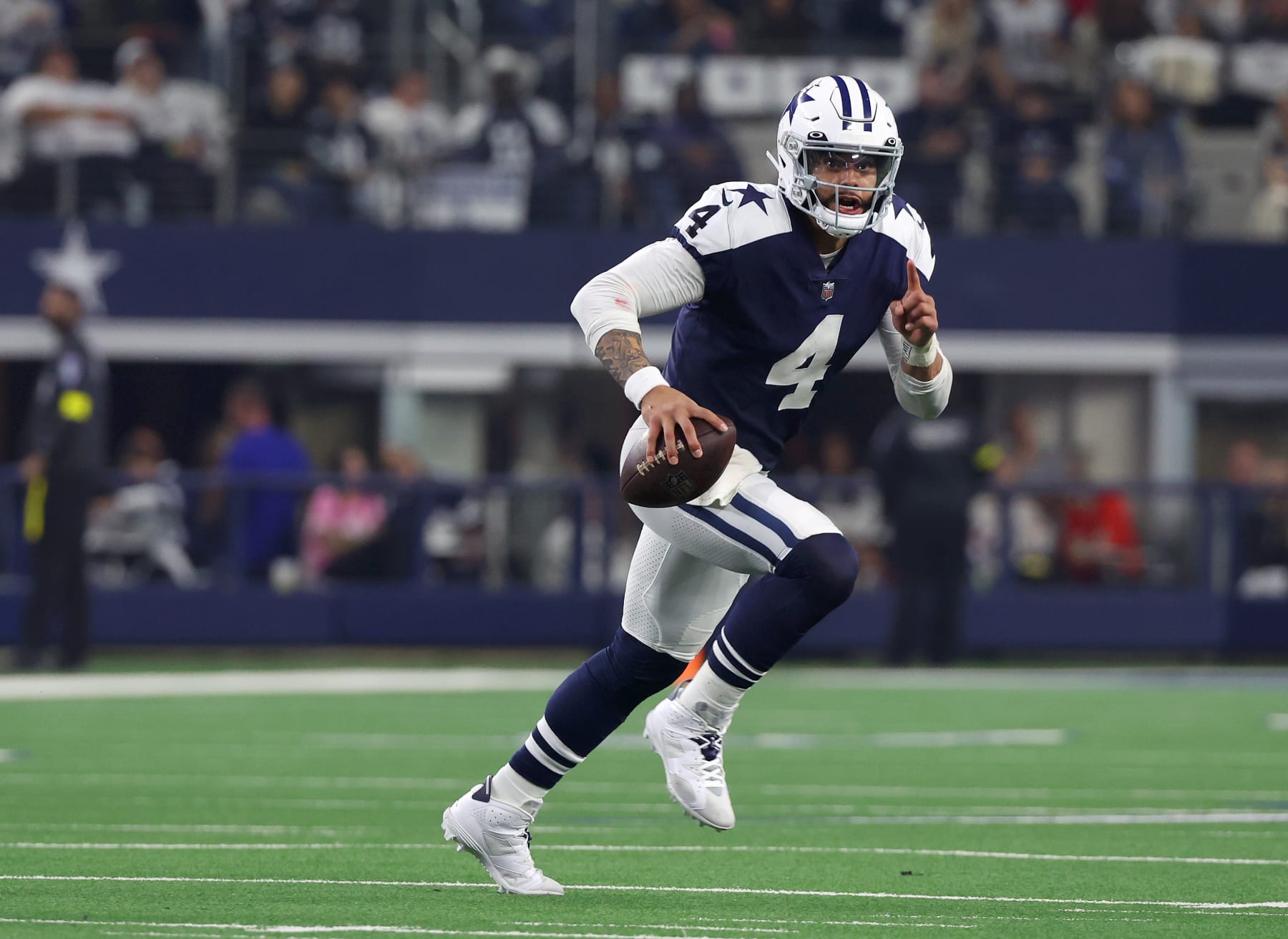 ARLINGTON, TEXAS - NOVEMBER 24: Dak Prescott #4 of the Dallas Cowboys scrambles in the pocket in a game against the New York Giants at AT&T Stadium on November 24, 2022 in Arlington, Texas. (Photo by Richard Rodriguez/Getty Images)