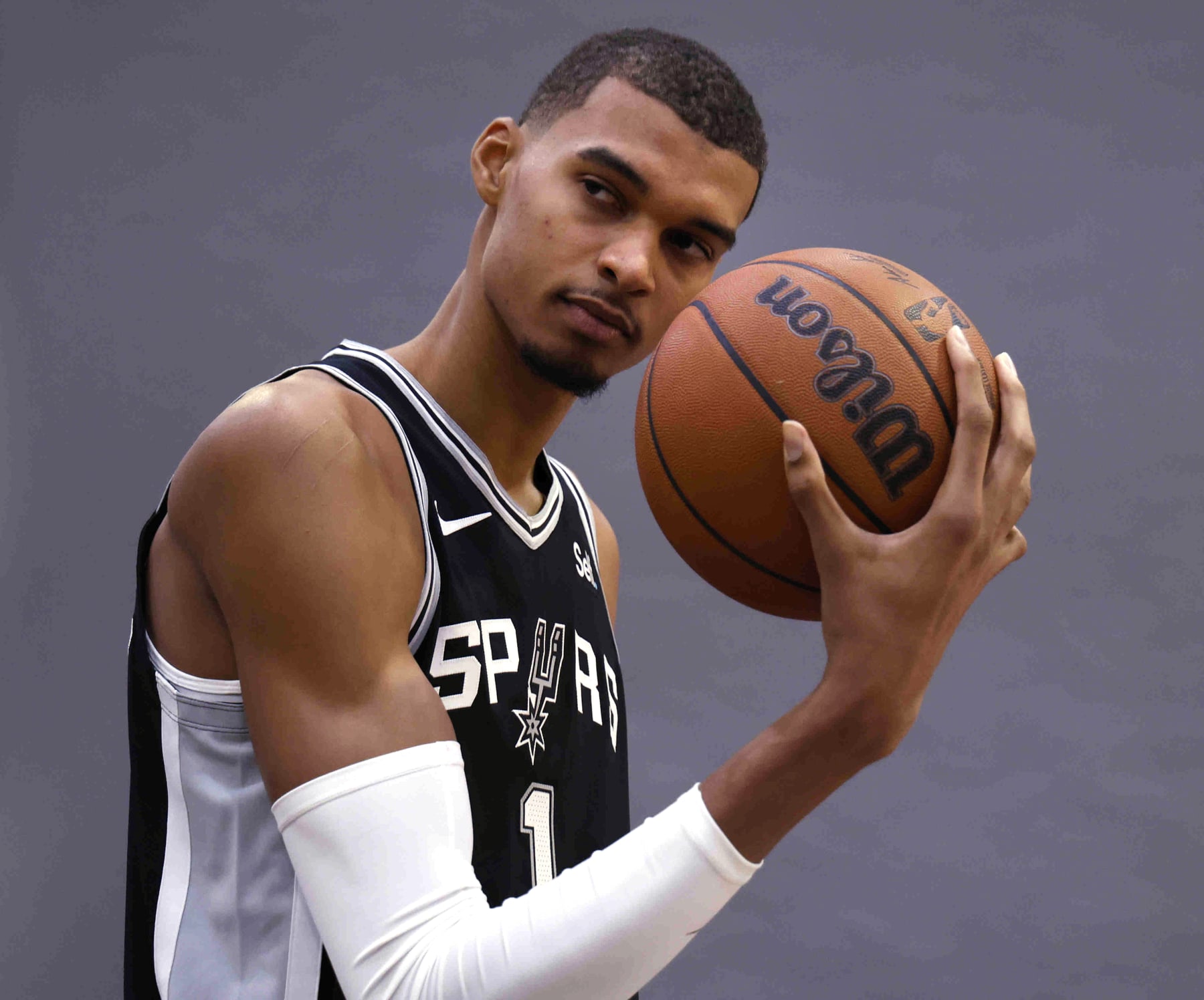 SAN ANTONIO, TX - OCTOBER 02:  Victor Wembanyama #1 of the San Antonio Spurs poses for photographs during San Antonio Media Day at 21 Spurs Lane on October 2, 2023 in San Antonio, Texas. NOTE TO USER: User expressly acknowledges and agrees that, by downloading and or using this photograph, User is consenting to the terms and conditions of the Getty Images License Agreement. (Photo by Ronald Cortes/Getty Images)