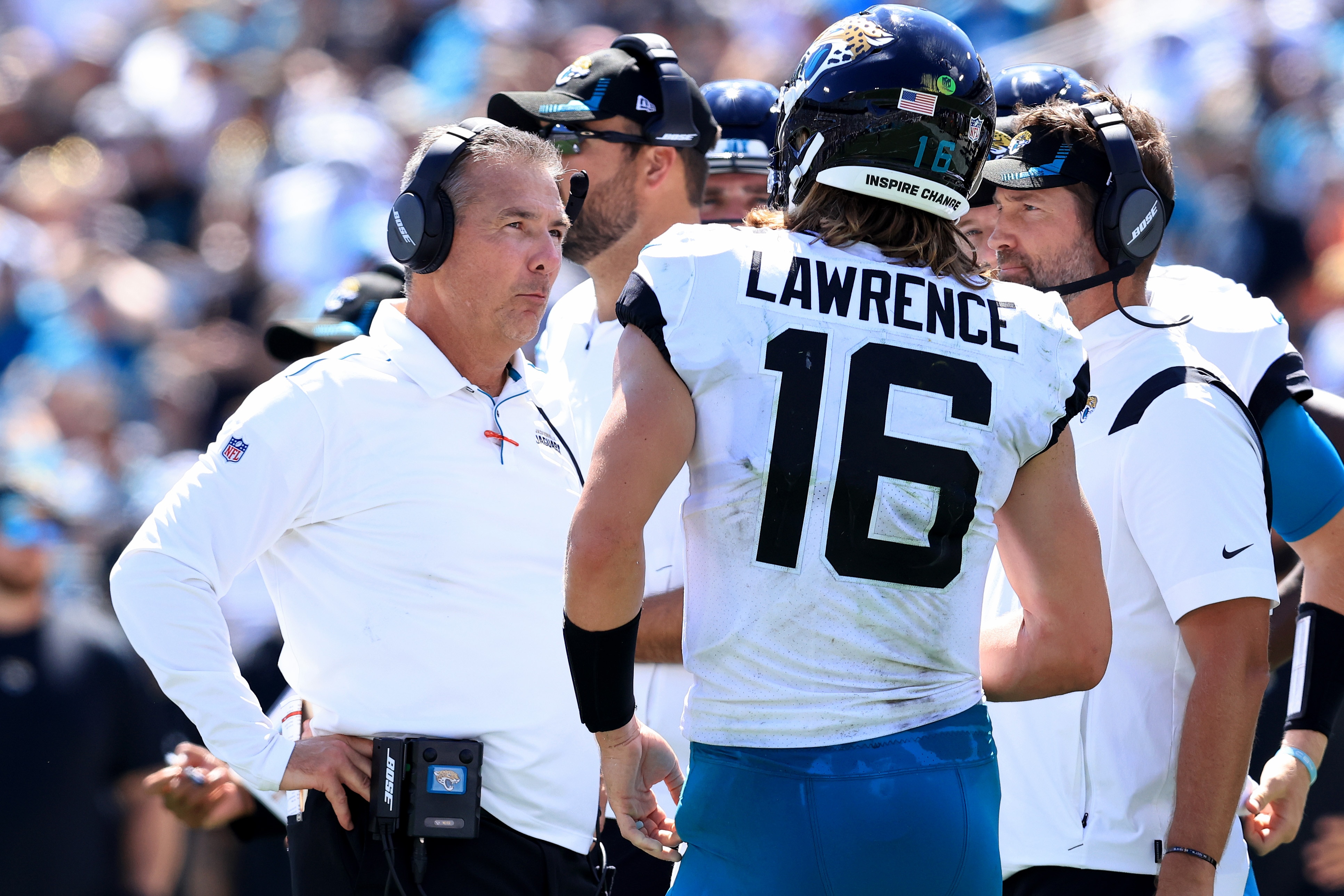 JACKSONVILLE, FLORIDA - SEPTEMBER 26: Head coach Urban Meyer (L) of the Jacksonville Jaguars speaks with Trevor Lawrence #16 during the game against the Arizona Cardinals at TIAA Bank Field on September 26, 2021 in Jacksonville, Florida. (Photo by Sam Greenwood/Getty Images)