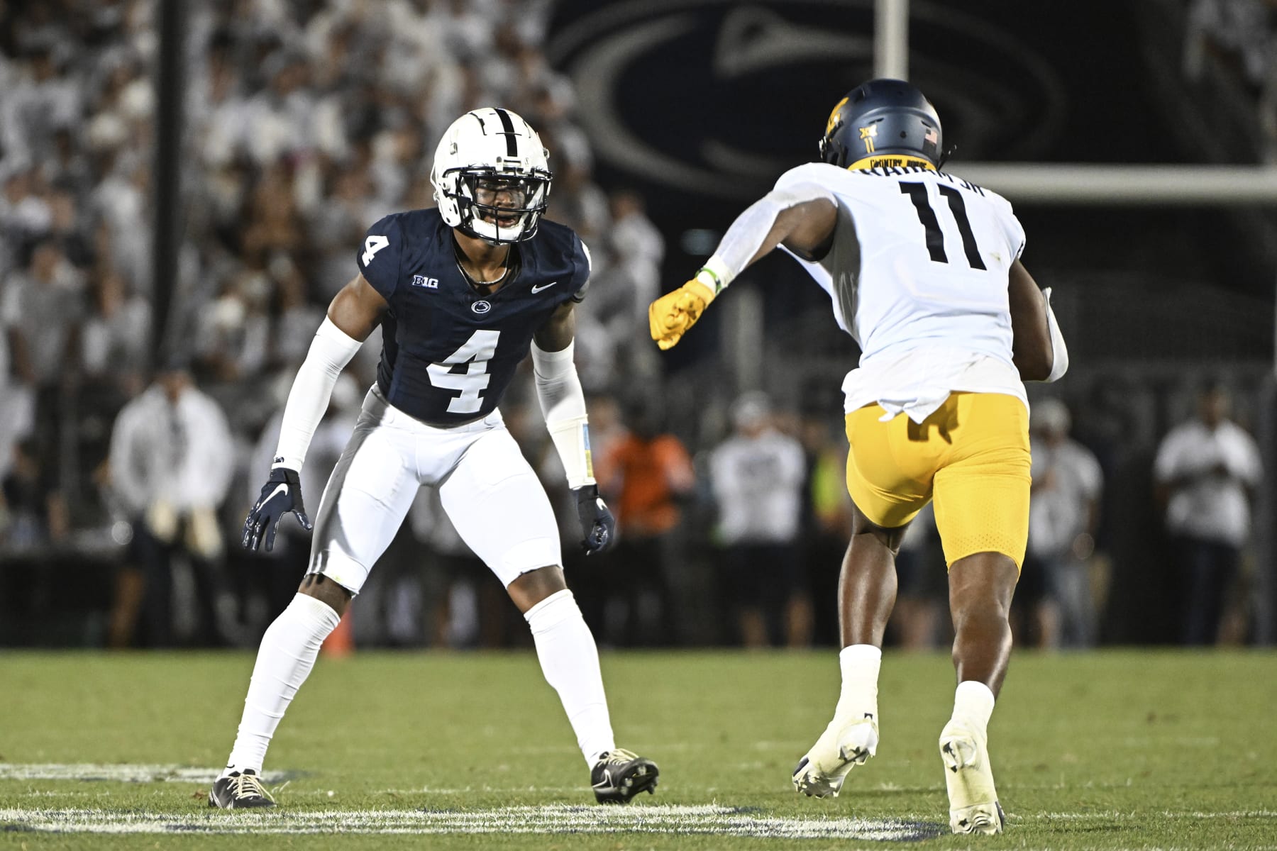 Penn State cornerback Kalen King (4) covers West Virginia wide receiver Cortez Braham (11) during an NCAA college football game, Saturday, Sept. 2, 2023, in State College, Pa. (AP Photo/Barry Reeger)