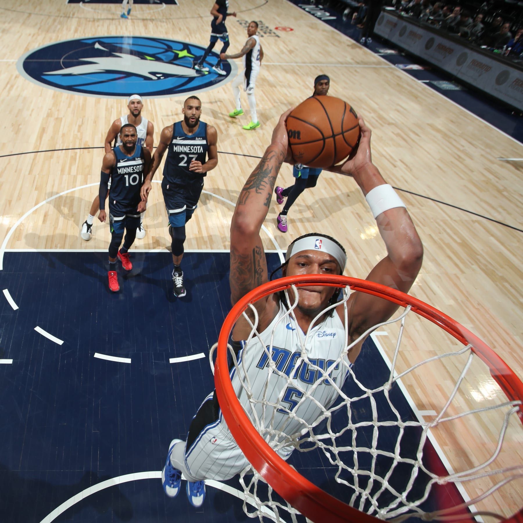 MINNEAPOLIS, MN -  FEBRUARY 2: Paolo Banchero #5 of the Orlando Magic drives to the basket during the game against the Minnesota Timberwolves on February 2, 2024 at Target Center in Minneapolis, Minnesota. NOTE TO USER: User expressly acknowledges and agrees that, by downloading and or using this Photograph, user is consenting to the terms and conditions of the Getty Images License Agreement. Mandatory Copyright Notice: Copyright 2024 NBAE (Photo by Jordan Johnson/NBAE via Getty Images)