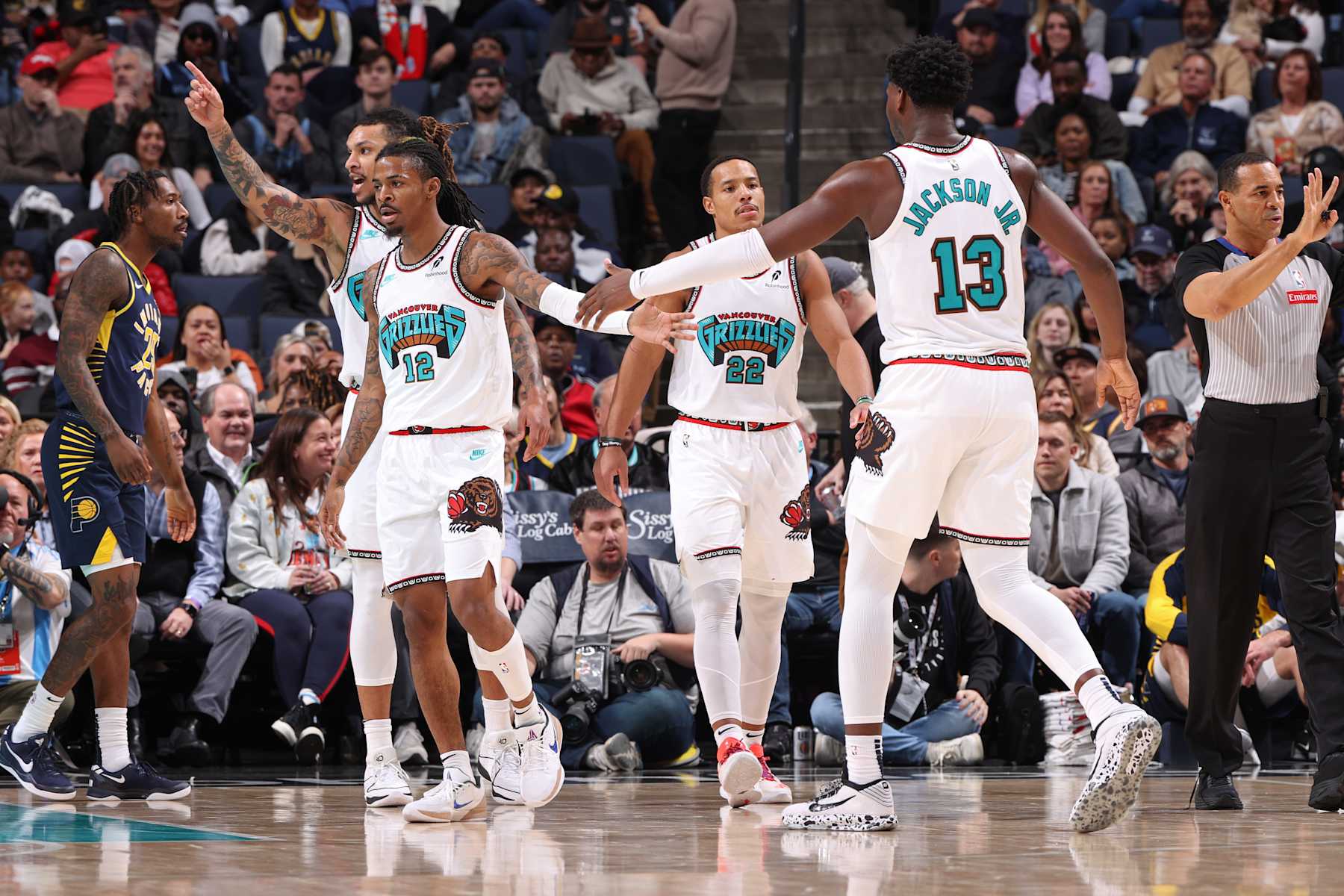 MEMPHIS, TN - DECEMBER 1: Ja Morant #12 and Jaren Jackson Jr. #13 of the Memphis Grizzlies high five during the game against the Indiana Pacers on December 1, 2024 at FedExForum in Memphis, Tennessee. NOTE TO USER: User expressly acknowledges and agrees that, by downloading and or using this photograph, User is consenting to the terms and conditions of the Getty Images License Agreement. Mandatory Copyright Notice: Copyright 2024 NBAE (Photo by Joe Murphy/NBAE via Getty Images)