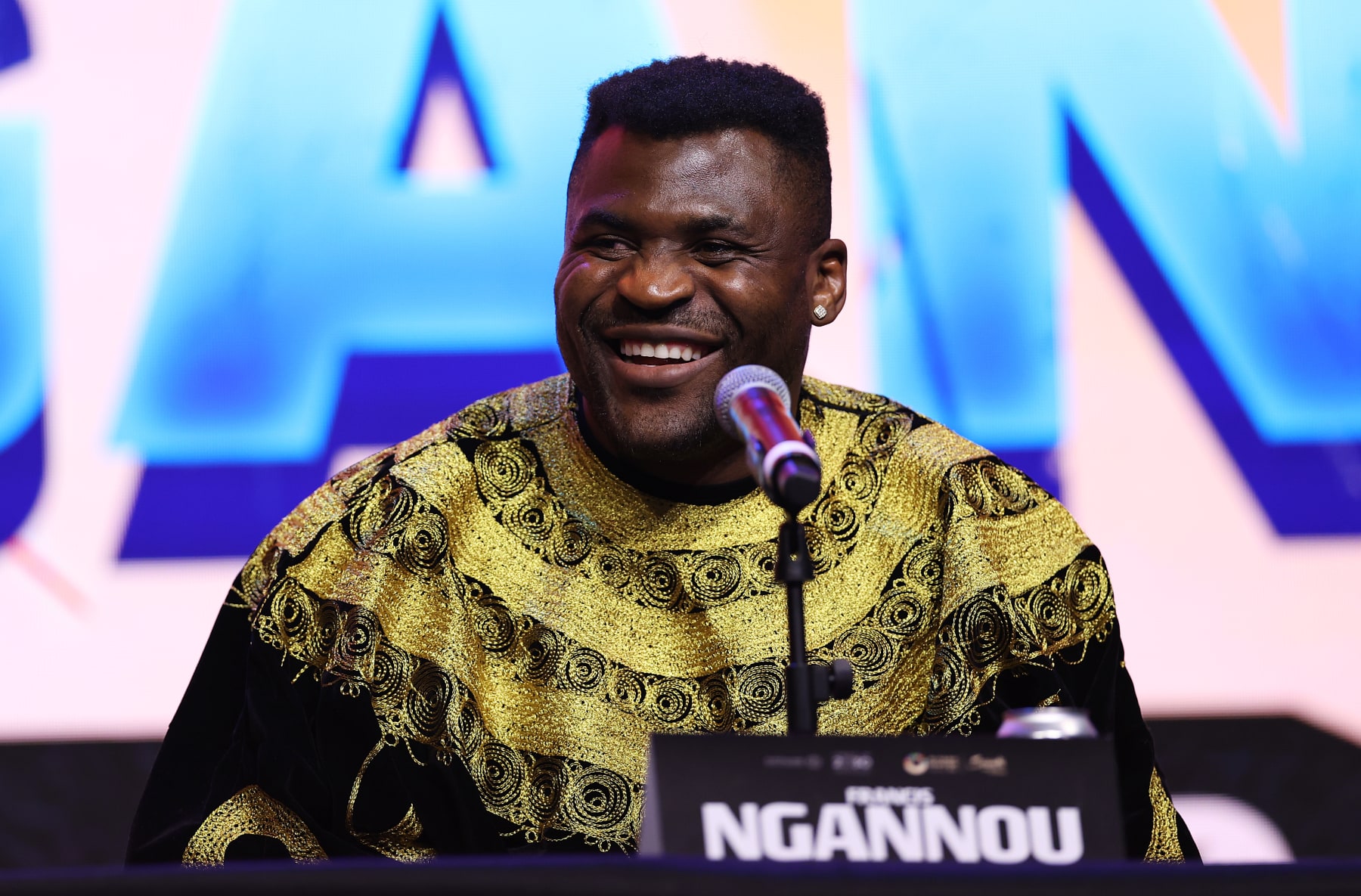 LONDON, ENGLAND - JANUARY 15: Francis Ngannou speaks during the Anthony Joshua v Francis Ngannou Press Conference at Outernet London on January 15, 2024 in London, England. (Photo by Alex Pantling/Getty Images)