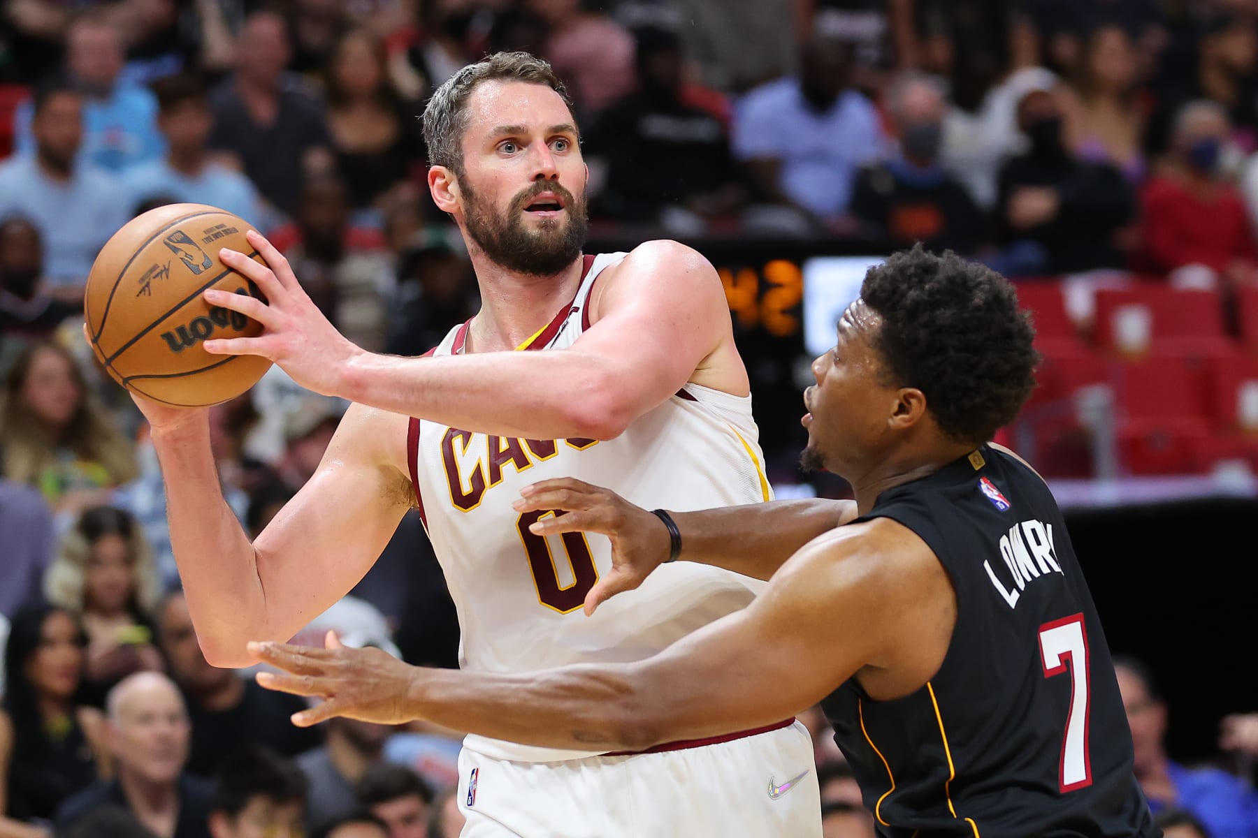 MIAMI, FLORIDA - MARCH 11: Kevin Love #0 of the Cleveland Cavaliers is defended by Kyle Lowry #7 of the Miami Heat during the first half at FTX Arena on March 11, 2022 in Miami, Florida. NOTE TO USER: User expressly acknowledges and agrees that, by downloading and or using this photograph, User is consenting to the terms and conditions of the Getty Images License Agreement. (Photo by Michael Reaves/Getty Images)