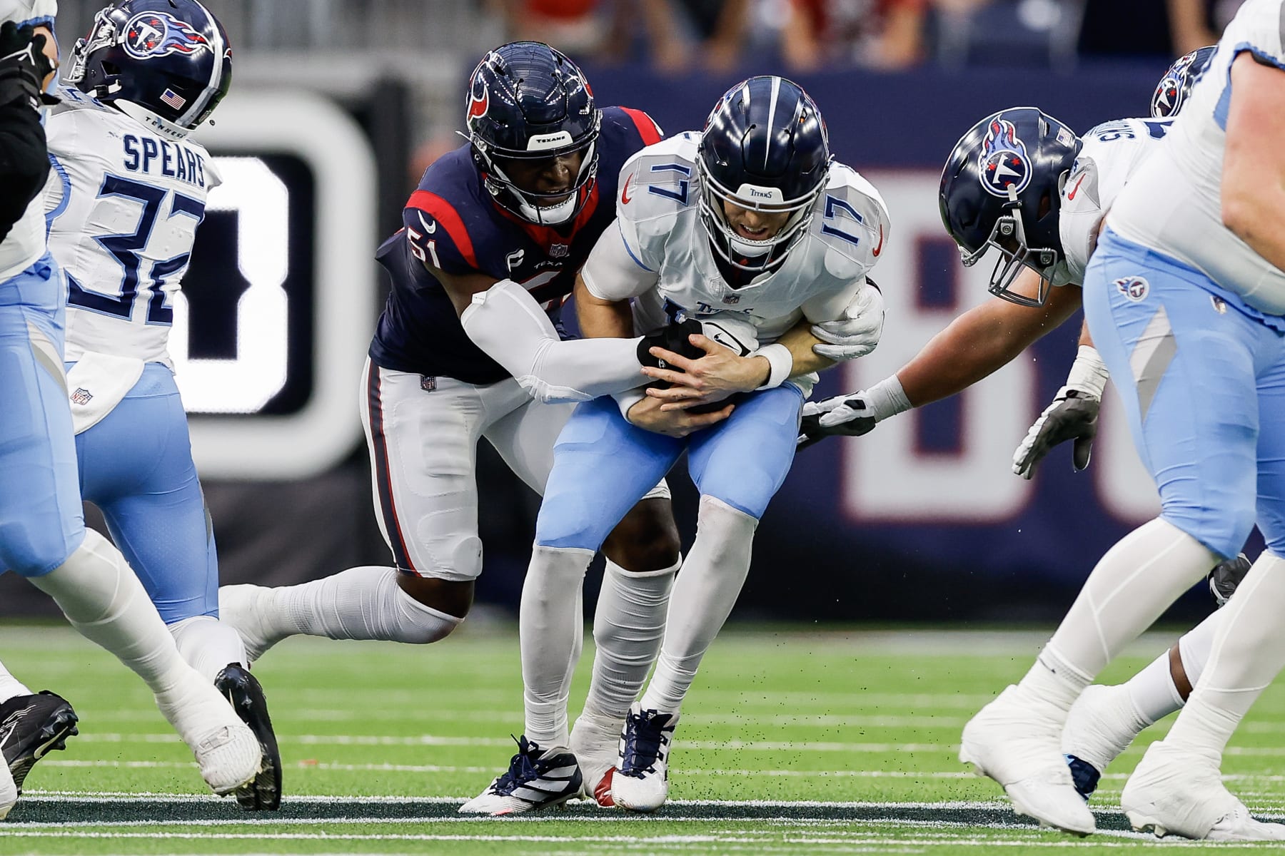 HOUSTON, TEXAS - DECEMBER 31: Ryan Tannehill #17 of the Tennessee Titans is sacked by Will Anderson Jr. #51 of the Houston Texans during the first half of a game at NRG Stadium on December 31, 2023 in Houston, Texas. (Photo by Wesley Hitt/Getty Images)