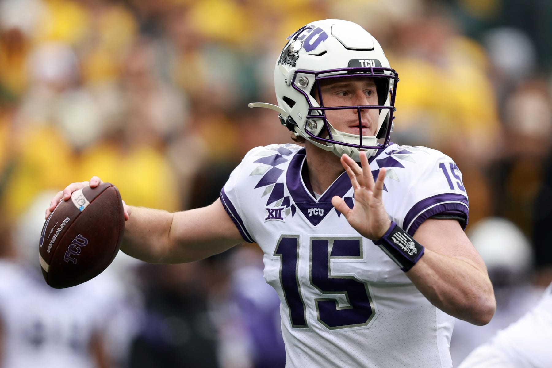 WACO, TEXAS - NOVEMBER 19:  Quarterback Max Duggan #15 of the TCU Horned Frogs looks for an open receiver against the Baylor Bears in the first quarter at McLane Stadium on November 19, 2022 in Waco, Texas. (Photo by Tom Pennington/Getty Images)