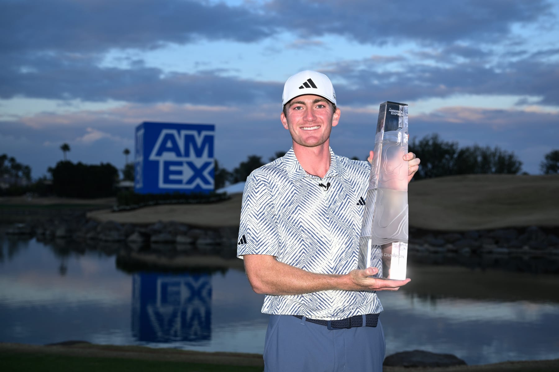 LA QUINTA, CALIFORNIA - JANUARY 21: Nick Dunlap of the United States poses for a photo with the trophy after winning The American Express at Pete Dye Stadium Course on January 21, 2024 in La Quinta, California. (Photo by Orlando Ramirez/Getty Images)