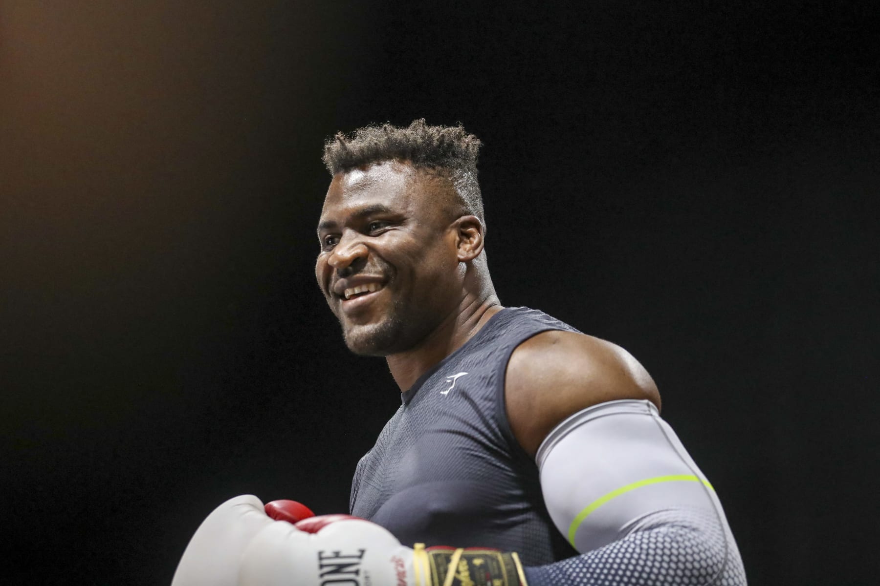 Cameroonian-French mixed martila arts star and boxer Francis Ngannou warms up while former US boxer Mike Tyson speaks to media during a training session at Ngannou's gym in Las Vegas, Nevada, on September 26, 2023. Mixed martial arts star Francis Ngannou will have heavyweight legend Mike Tyson in his corner when he faces World Boxing Council heavyweight champion Tyson Fury in the boxing ring in Saudi Arabia on October 28. (Photo by Ian Maule / AFP) (Photo by IAN MAULE/AFP via Getty Images)