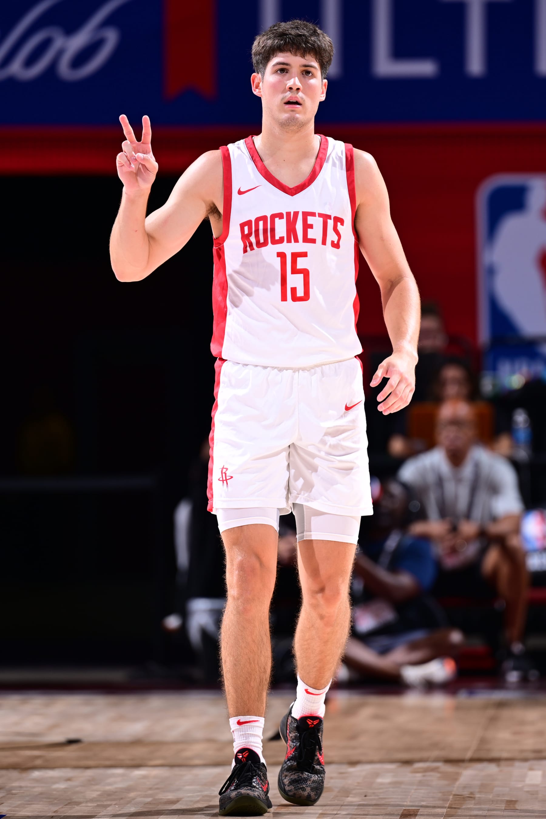 LAS VEGAS, NV - JULY 18: Reed Sheppard #15 of the Houston Rockets signals during the game against the Minnesota Timberwolves on July 18, 2024 at the Thomas & Mack Center in Las Vegas, Nevada. NOTE TO USER: User expressly acknowledges and agrees that, by downloading and or using this photograph, User is consenting to the terms and conditions of the Getty Images License Agreement. Mandatory Copyright Notice: Copyright 2024 NBAE (Photo by Adam Hagy/NBAE via Getty Images)