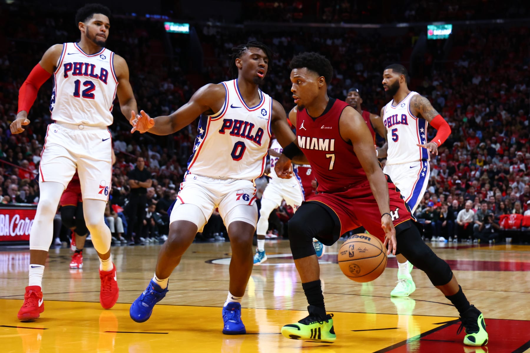 MIAMI, FLORIDA - DECEMBER 25: Kyle Lowry #7 of the Miami Heat drives against Tyrese Maxey #0 of the Philadelphia 76ers during the third quarter at Kaseya Center on December 25, 2023 in Miami, Florida. NOTE TO USER: User expressly acknowledges and agrees that, by downloading and or using this photograph, User is consenting to the terms and conditions of the Getty Images License Agreement. (Photo by Megan Briggs/Getty Images)