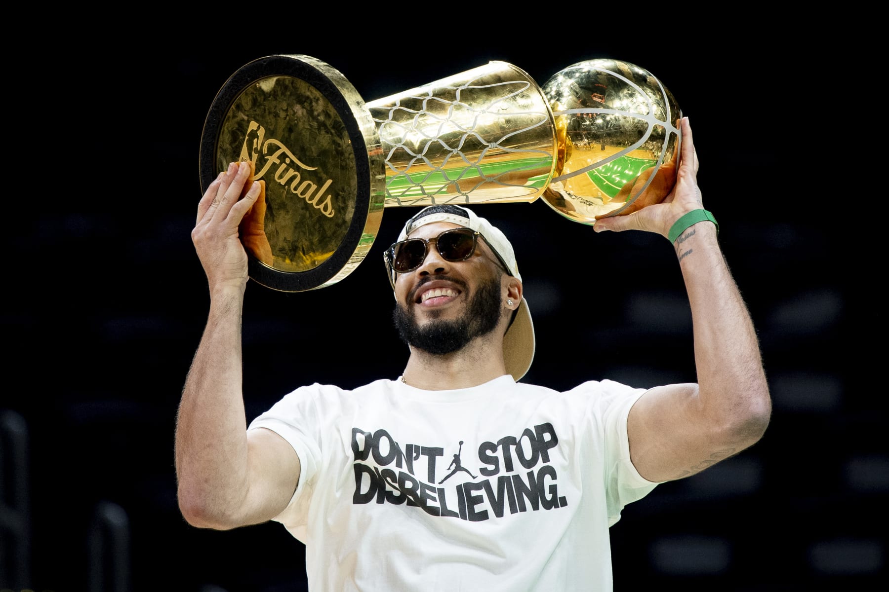 BOSTON, MASSACHUSETTS - JUNE 21: Jayson Tatum #0 of the Boston Celtics hoists the Larry O'Brien trophy as he is introduced during the Boston Celtics Victory Event following their 2024 NBA Finals win at TD Garden on June 21, 2024 in Boston, Massachusetts. (Photo by Maddie Malhotra/Getty Images)