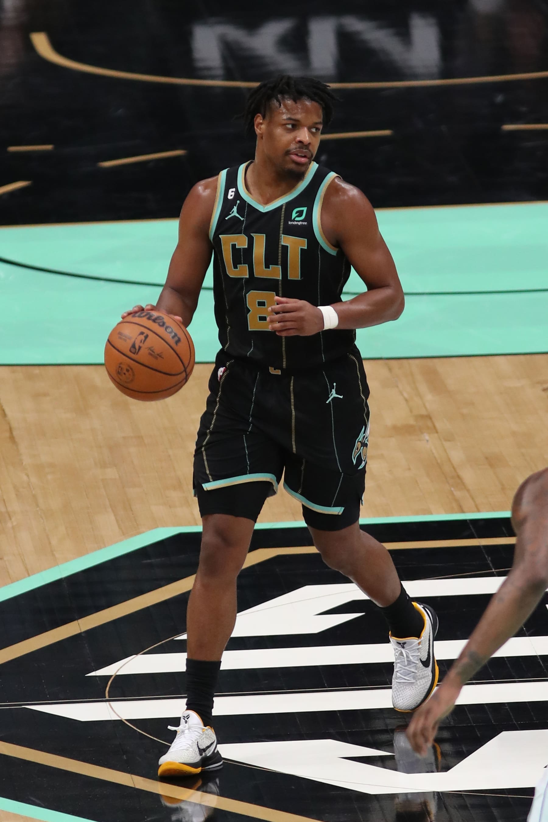 CHARLOTTE, NC - MARCH 26: Dennis Smith Jr. #8 of the Charlotte Hornets dribbles the ball during the game against the Dallas Mavericks on March 26, 2023 at Spectrum Center in Charlotte, North Carolina. NOTE TO USER: User expressly acknowledges and agrees that, by downloading and or using this photograph, User is consenting to the terms and conditions of the Getty Images License Agreement.  Mandatory Copyright Notice:  Copyright 2023 NBAE (Photo by Brock Williams-Smith/NBAE via Getty Images)