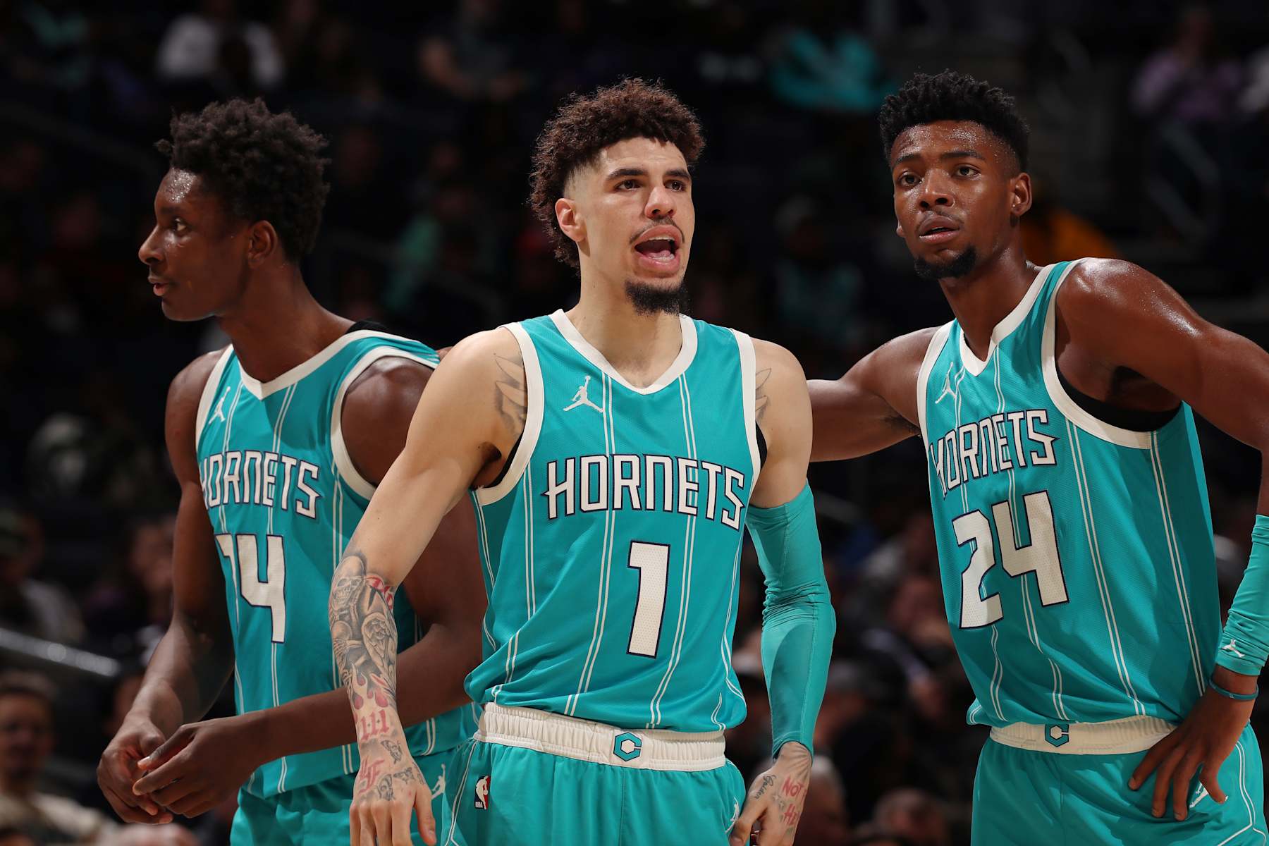 CHARLOTTE, NC - NOVEMBER 21: LaMelo Ball #1, Moussa Diabate #14 and Brandon Miller #24 of the Charlotte Hornets look on during the game against the Detroit Pistons on November 21, 2024 at Spectrum Center in Charlotte, North Carolina. NOTE TO USER: User expressly acknowledges and agrees that, by downloading and or using this photograph, User is consenting to the terms and conditions of the Getty Images License Agreement. Mandatory Copyright Notice: Copyright 2024 NBAE (Photo by Kent Smith/NBAE via Getty Images)