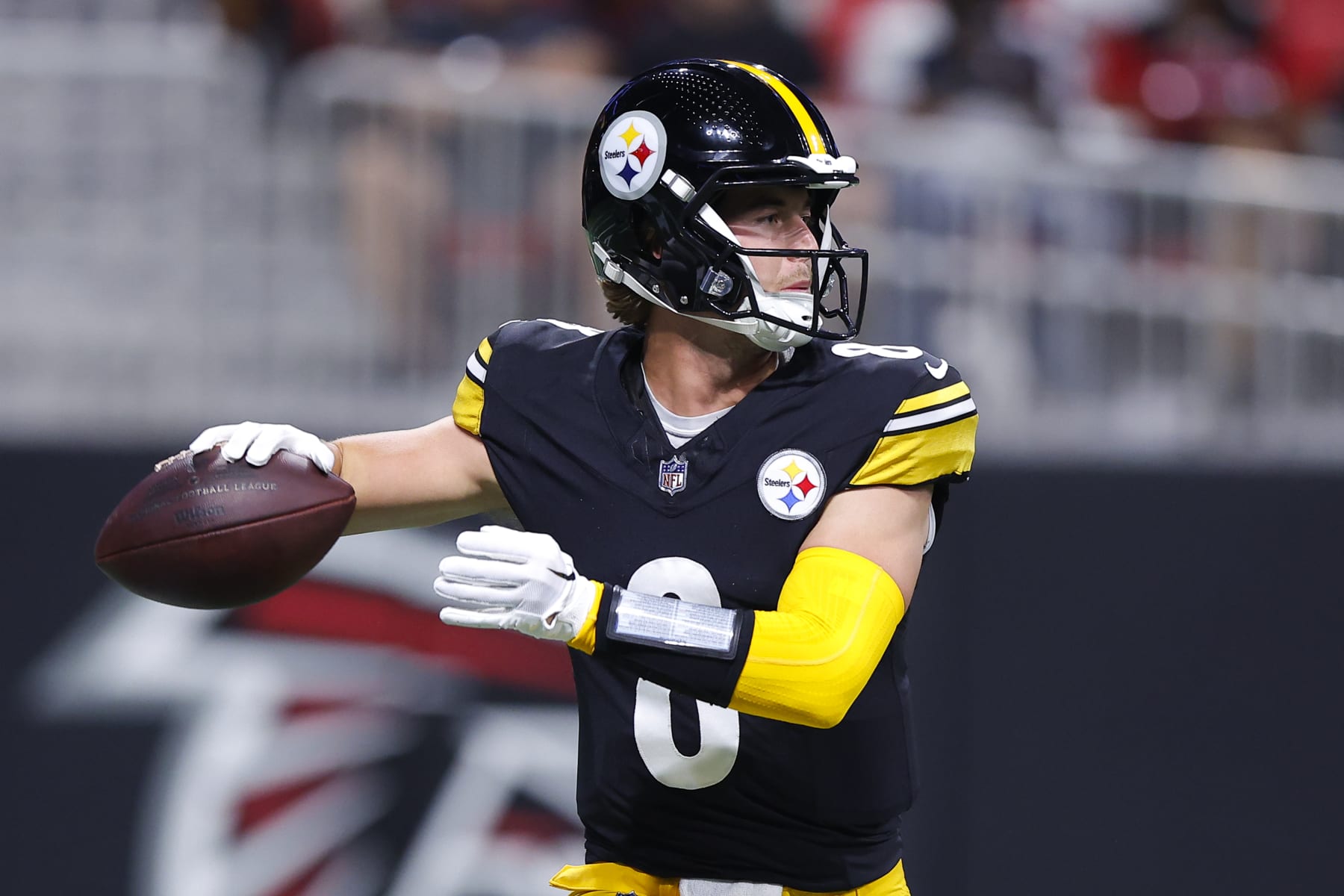 ATLANTA, GEORGIA - AUGUST 24: Kenny Pickett #8 of the Pittsburgh Steelers rolls out to pass during the first quarter of a preseason game against the Atlanta Falcons at Mercedes-Benz Stadium on August 24, 2023 in Atlanta, Georgia. (Photo by Todd Kirkland/Getty Images)