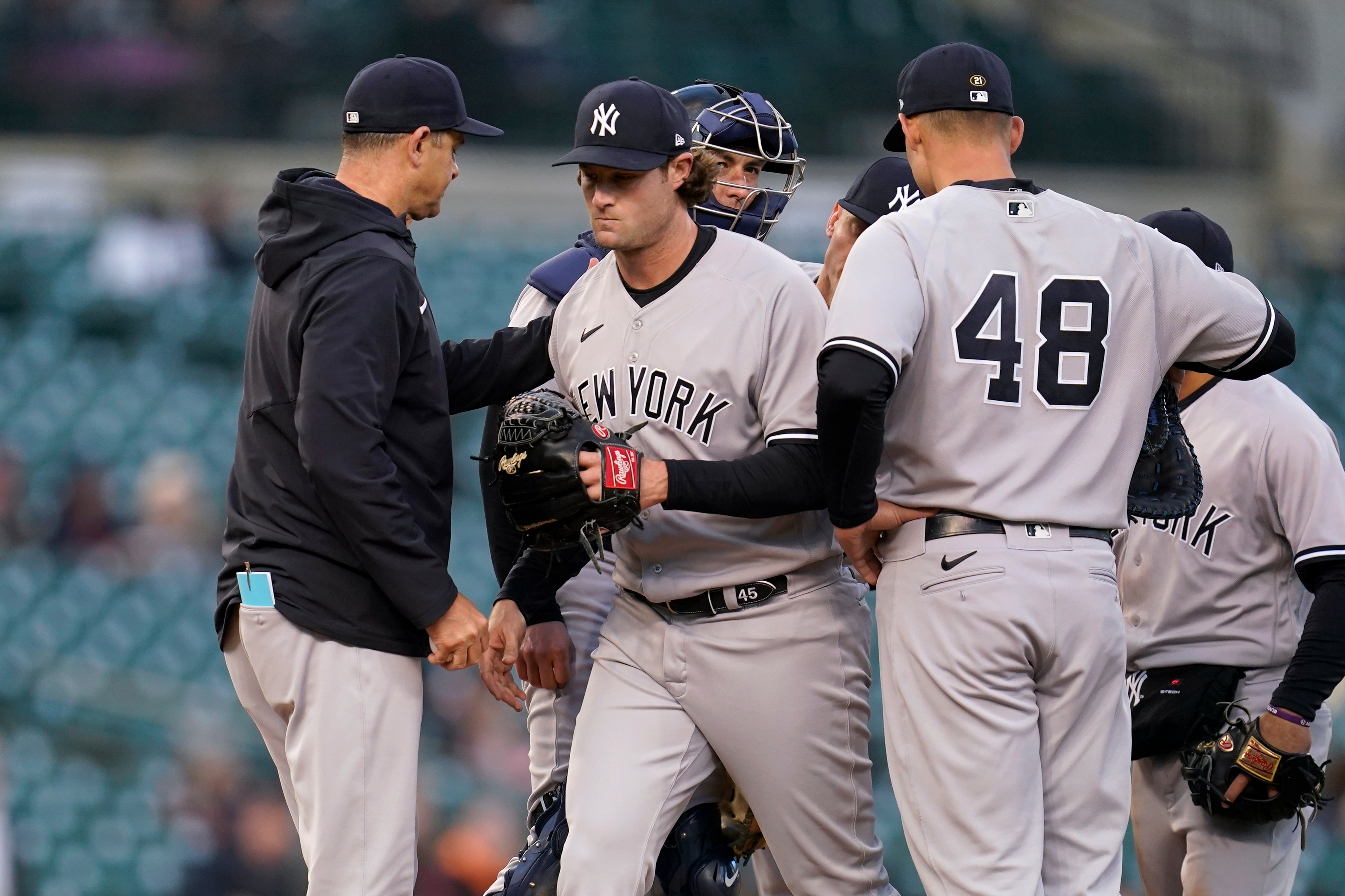 New York Yankees manager Aaron Boone takes the ball from pitcher Gerrit Cole against the Detroit Tigers in the second inning of a baseball game in Detroit, Tuesday, April 19, 2022. (AP Photo/Paul Sancya)
