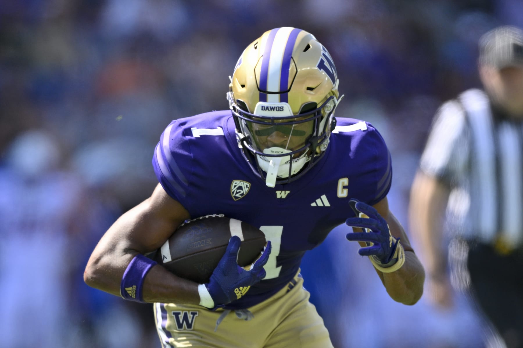 SEATTLE, WASHINGTON - SEPTEMBER 02: Rome Odunze #1 of the Washington Huskies runs with the ball during the first quarter against the Washington Huskies at Husky Stadium on September 02, 2023 in Seattle, Washington. (Photo by Alika Jenner/Getty Images)
