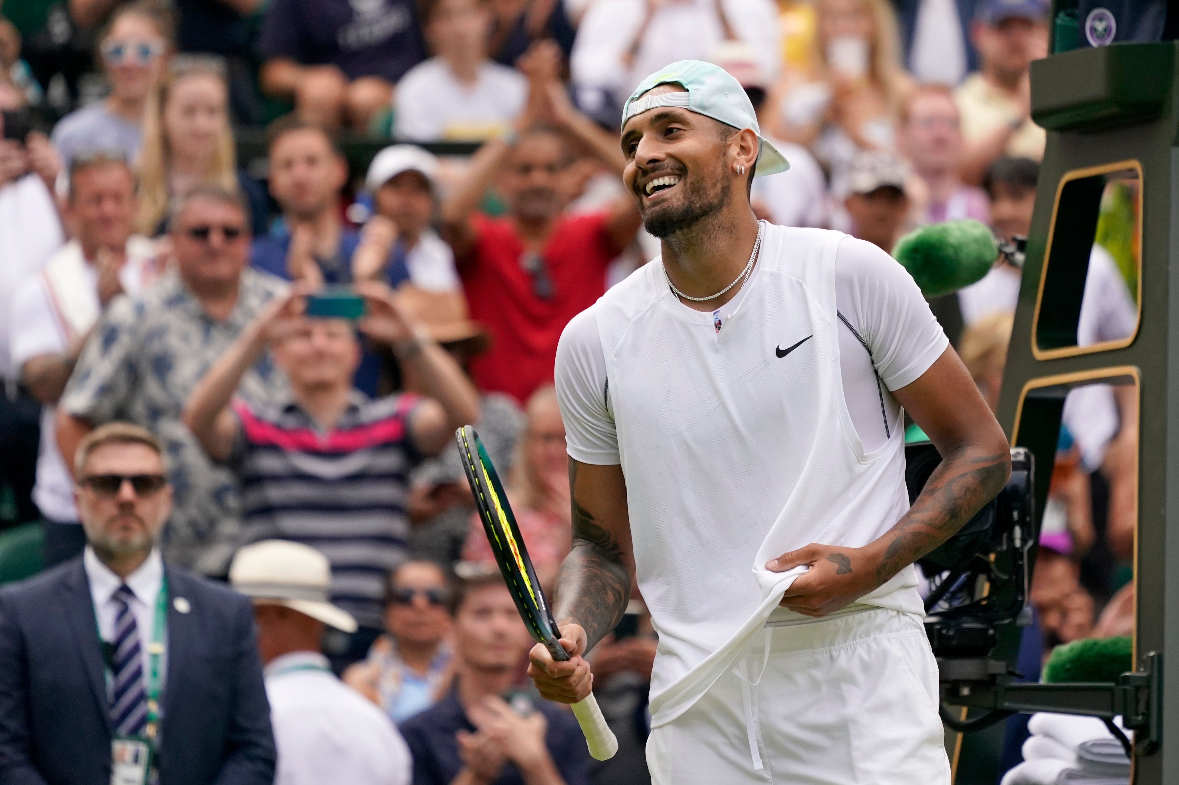 Australia's Nick Kyrgios celebrates after beating Brandon Nakashima of the US in a men's singles fourth round match on day eight of the Wimbledon tennis championships in London, Monday, July 4, 2022. (AP Photo/Alberto Pezzali)