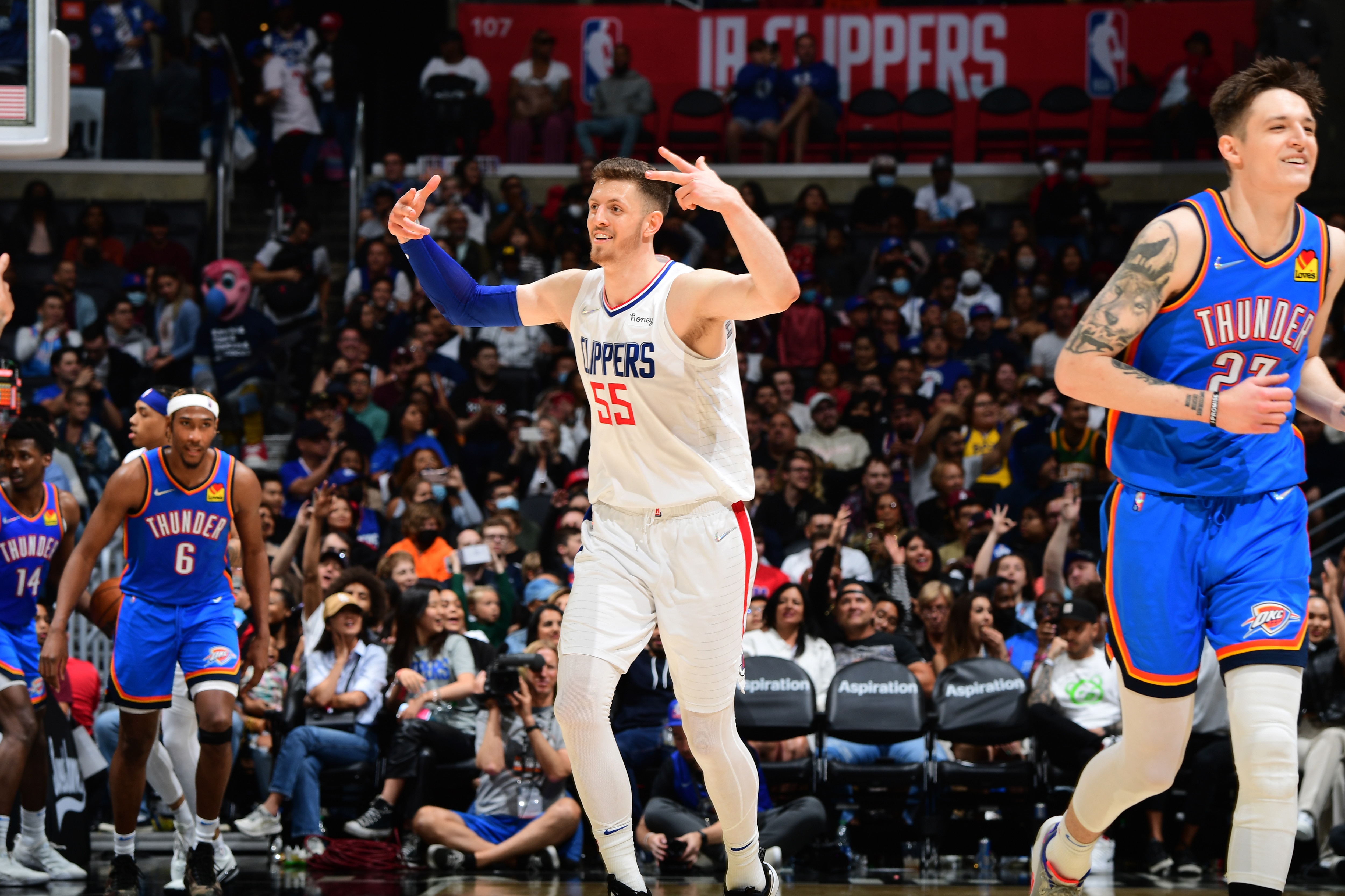 LOS ANGELES, CA - APRIl 10: Isaiah Hartenstein #55 of the LA Clippers celebrates during the game against the Oklahoma City Thunder on April 10, 2022 at Crypto.Com Arena in Los Angeles, California. NOTE TO USER: User expressly acknowledges and agrees that, by downloading and/or using this Photograph, user is consenting to the terms and conditions of the Getty Images License Agreement. Mandatory Copyright Notice: Copyright 2022 NBAE (Photo by Adam Pantozzi/NBAE via Getty Images)