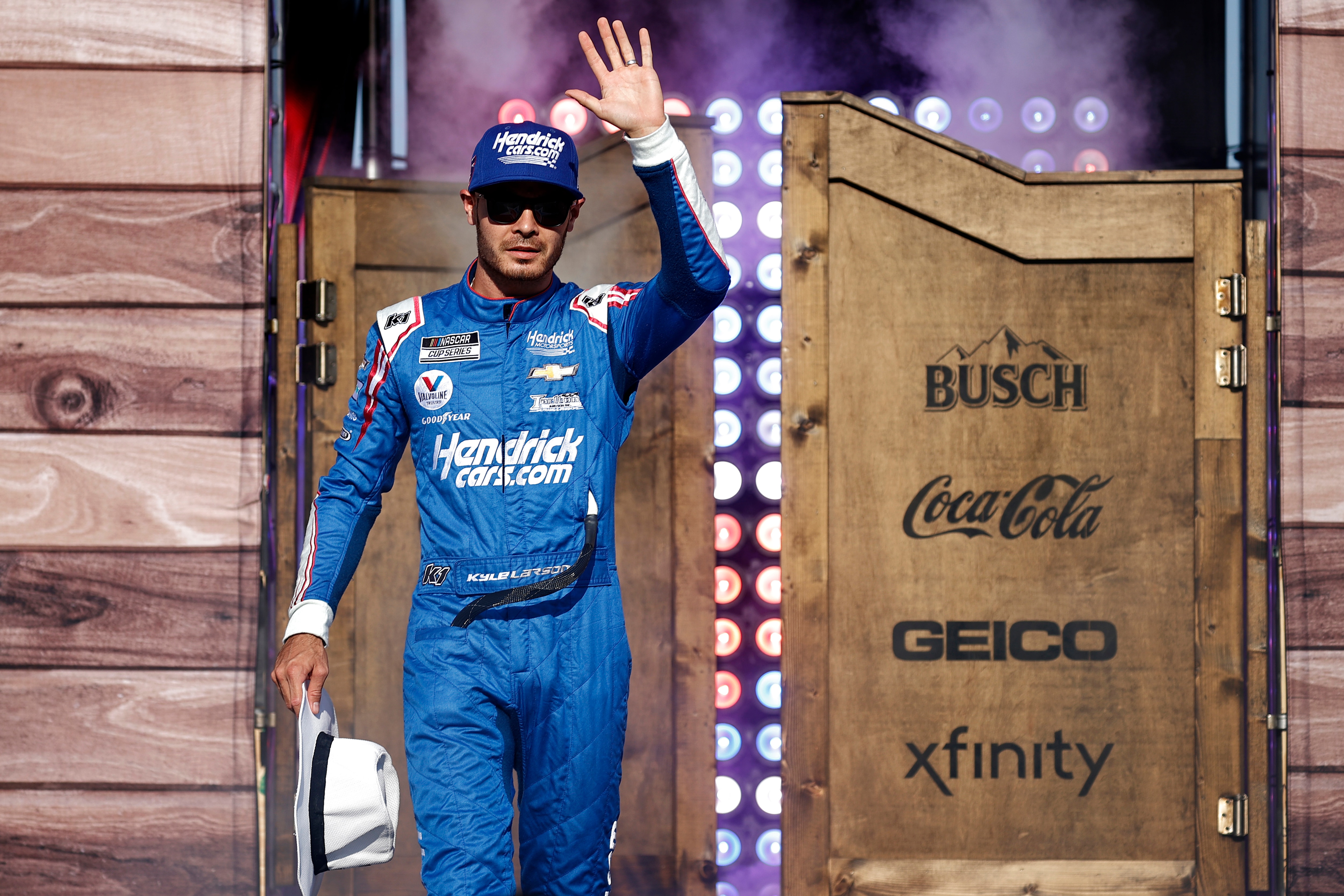 FORT WORTH, TEXAS - JUNE 13: Kyle Larson, driver of the #5 HendrickCars.com Chevrolet, waves to fans on stage during driver intros prior the NASCAR All-Star Race at Texas Motor Speedway on June 13, 2021 in Fort Worth, Texas. (Photo by Chris Graythen/Getty Images)