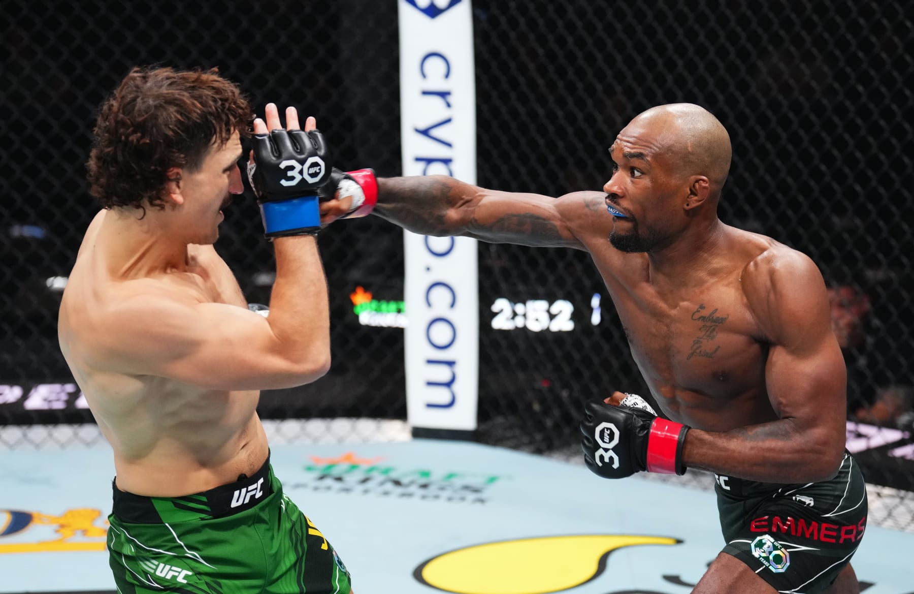 JACKSONVILLE, FLORIDA - JUNE 24:  (R-L) Jamall Emmers punches Jack Jenkins of Australia in their featherweight fight during the UFC Fight Night event at Vystar Veterans Memorial Arena on June 24, 2023 in Jacksonville, Florida. (Photo by Josh Hedges/Zuffa LLC)