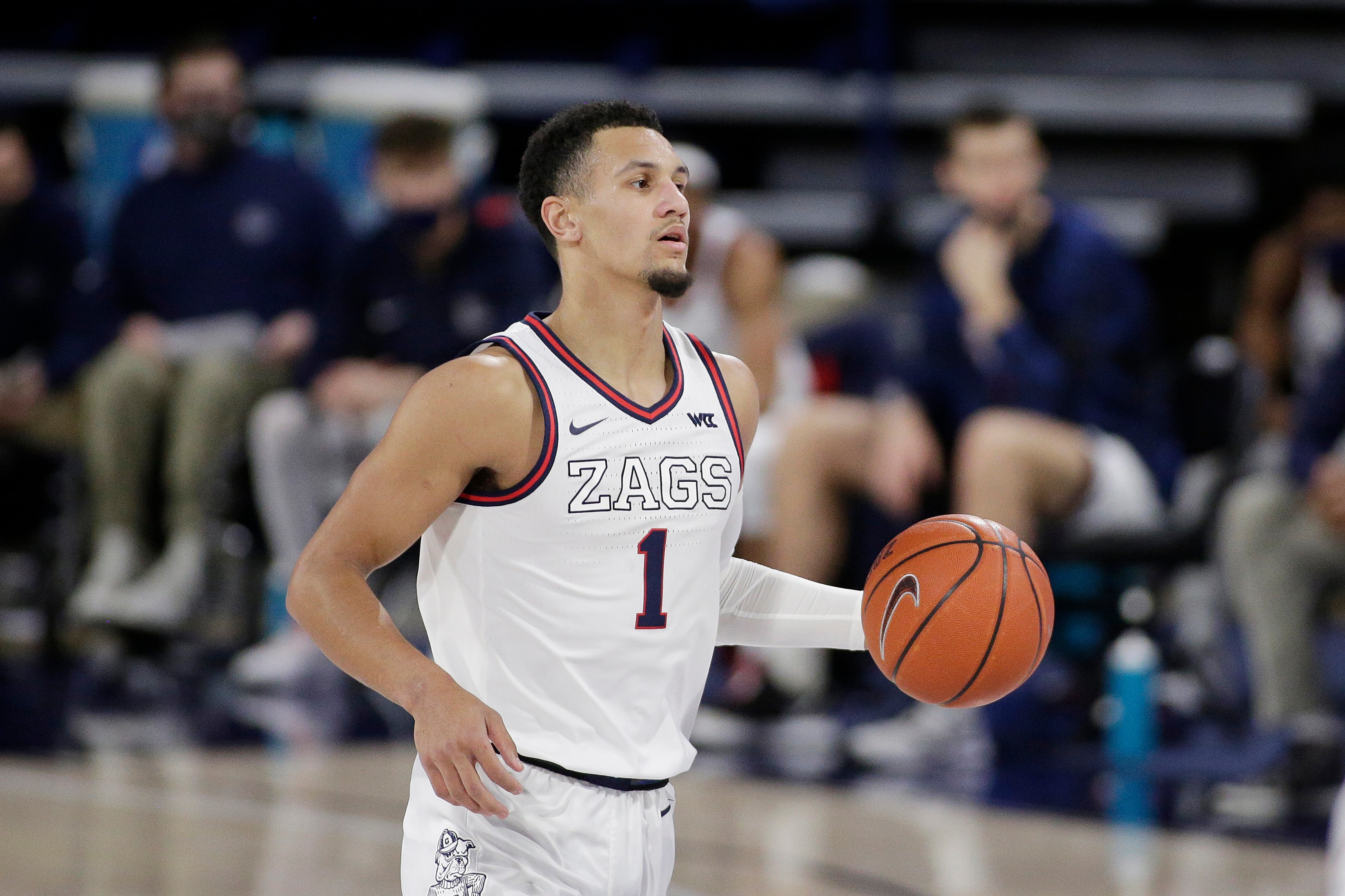 Gonzaga guard Jalen Suggs brings the ball up the court during the first half of an NCAA college basketball game against Loyola Marymount in Spokane, Wash., Saturday, Feb. 27, 2021. (AP Photo/Young Kwak)