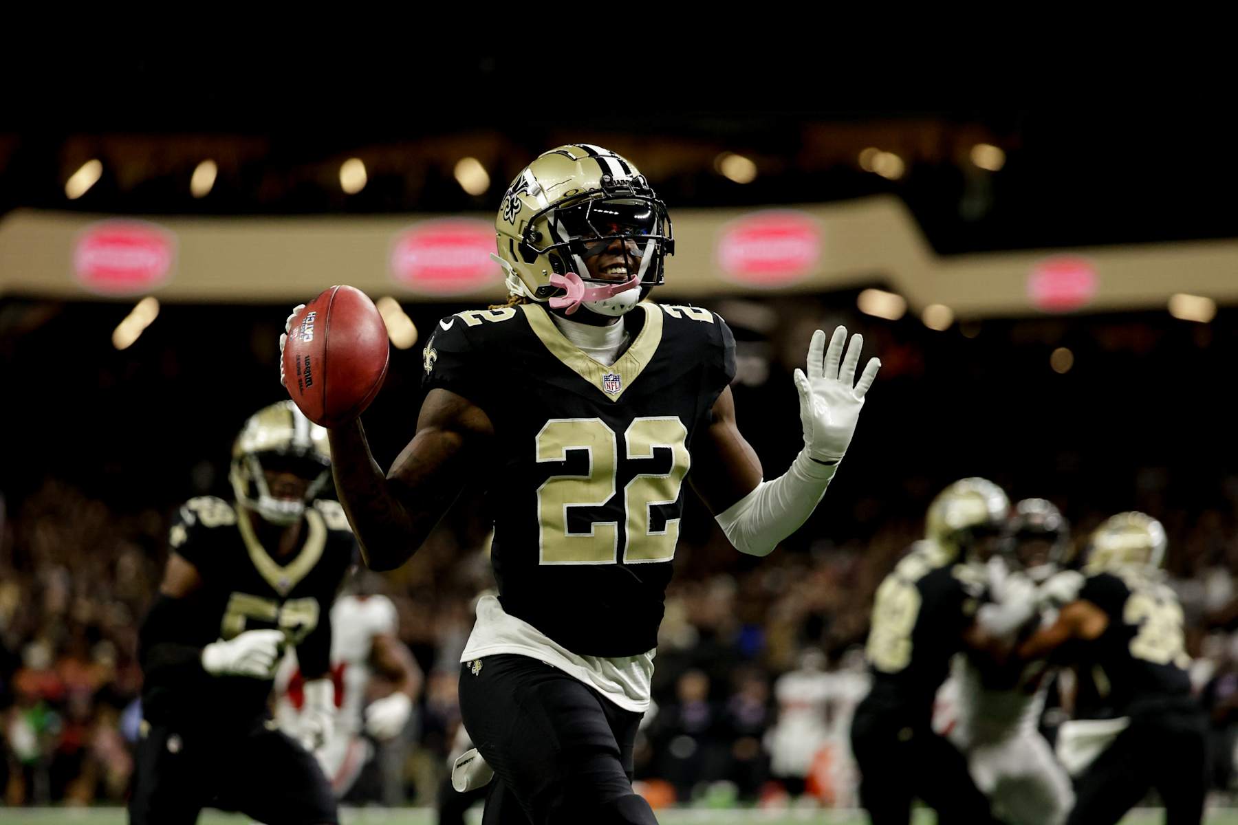 NEW  ORLEANS, LOUISIANA - OCTOBER 13: Rashid Shaheed #22 of the New Orleans Saints celebrates as he runs back a punt for a touchdown against the Tampa Bay Buccaneers during the first half of a game at the Caesars Superdome on October 13, 2024 in New Orleans, Louisiana. (Photo by Derick E. Hingle/Getty Images)