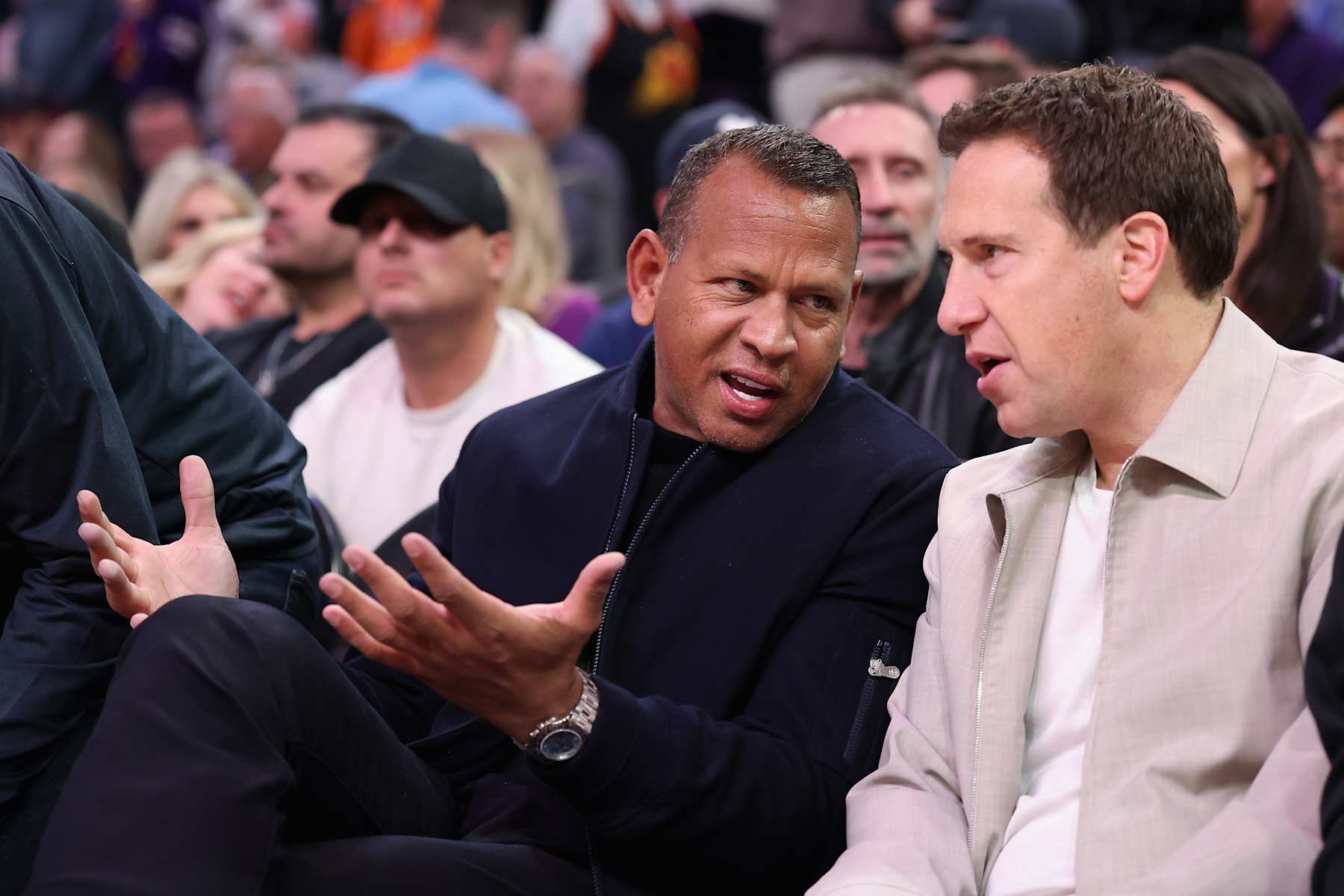 PHOENIX, ARIZONA - JANUARY 29: Former professional baseball player Alex Rodriguez and Phoenix Suns owner Mat Ishbia talk before the NBA game against the Minnesota Timberwolves at Footprint Center on January 29, 2025 in Phoenix, Arizona. NOTE TO USER: User expressly acknowledges and agrees that, by downloading and or using this photograph, User is consenting to the terms and conditions of the Getty Images License Agreement.  (Photo by Christian Petersen/Getty Images)
