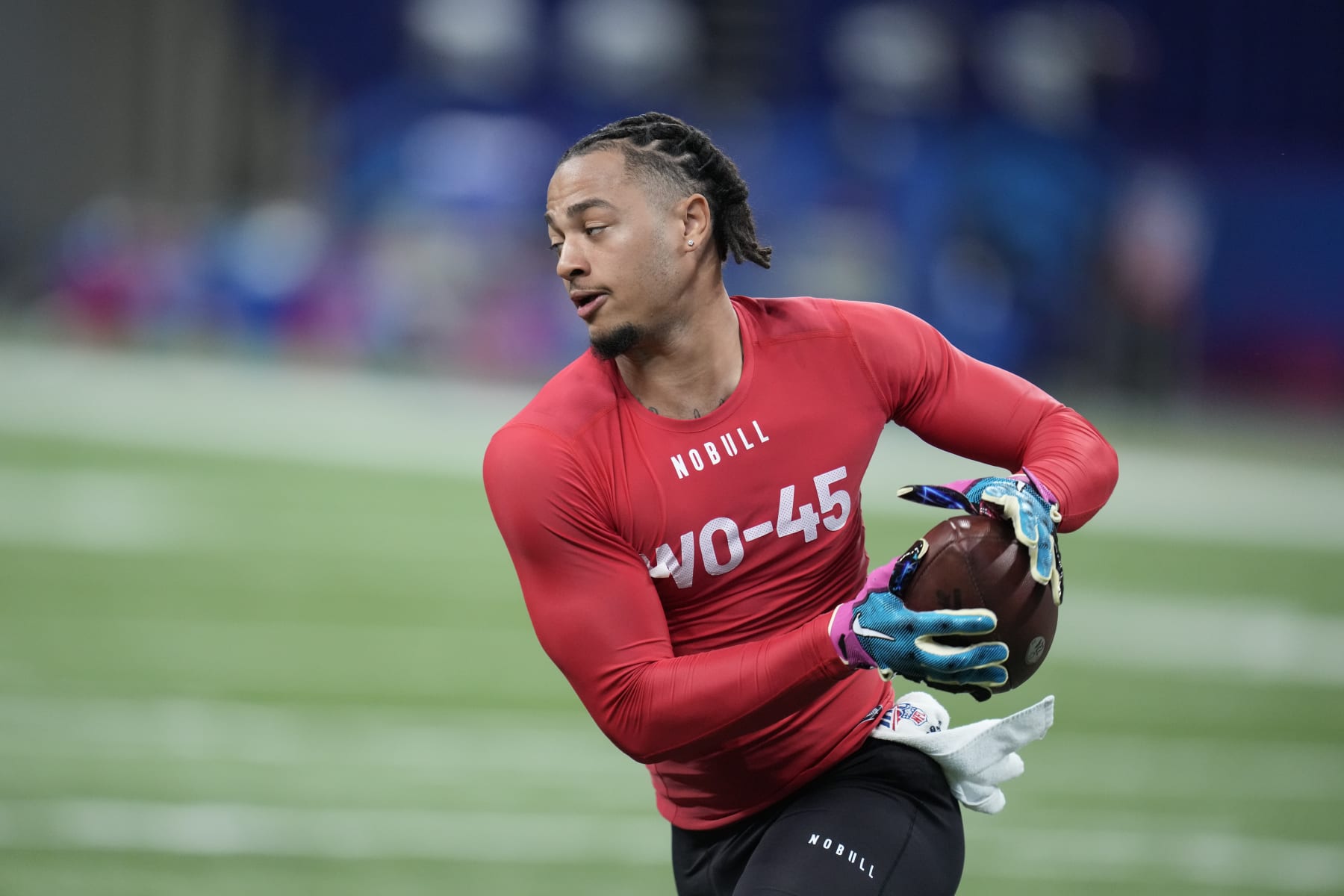 Ohio State wide receiver Jaxon Smith-Njigba runs a drill at the NFL football scouting combine in Indianapolis, Saturday, March 4, 2023. (AP Photo/Michael Conroy)