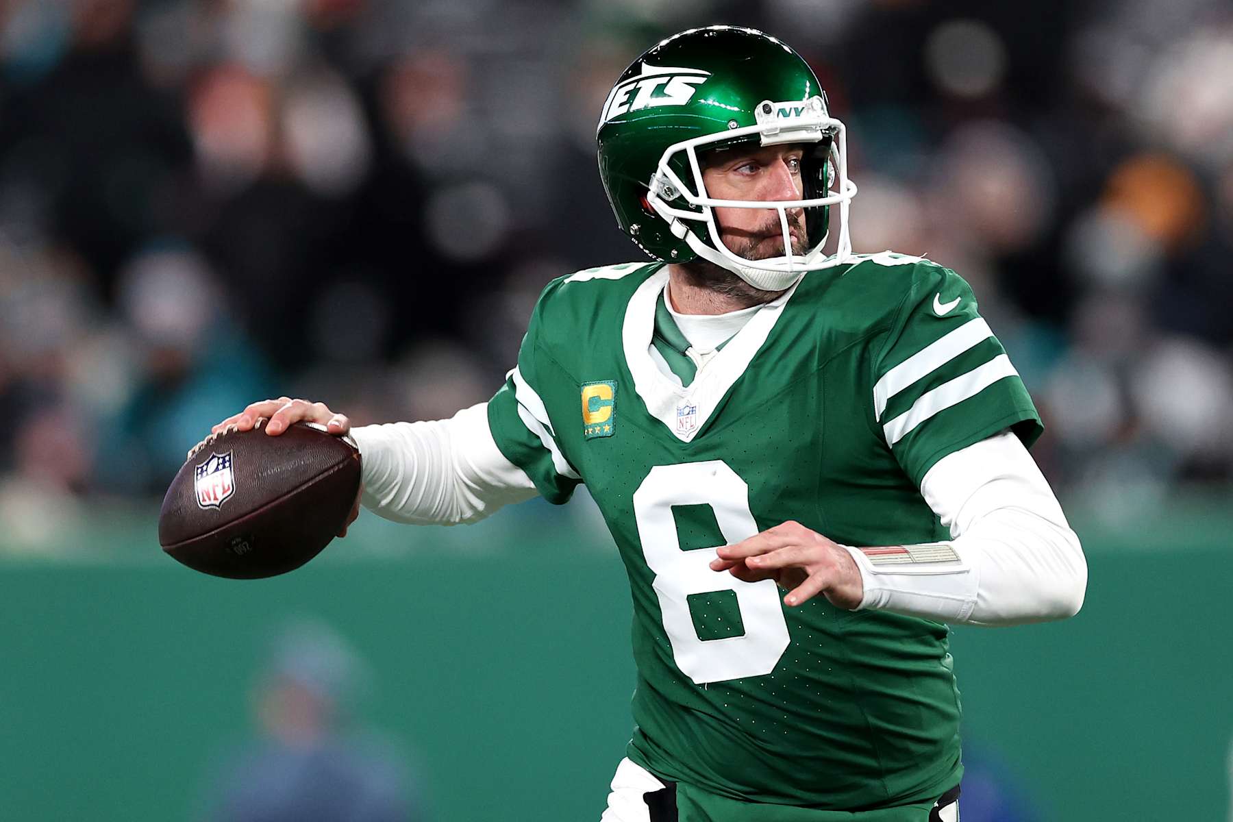 EAST RUTHERFORD, NEW JERSEY - JANUARY 05: Aaron Rodgers #8 of the New York Jets in action against the Miami Dolphins at MetLife Stadium on January 05, 2025 in East Rutherford, New Jersey. (Photo by Luke Hales/Getty Images)