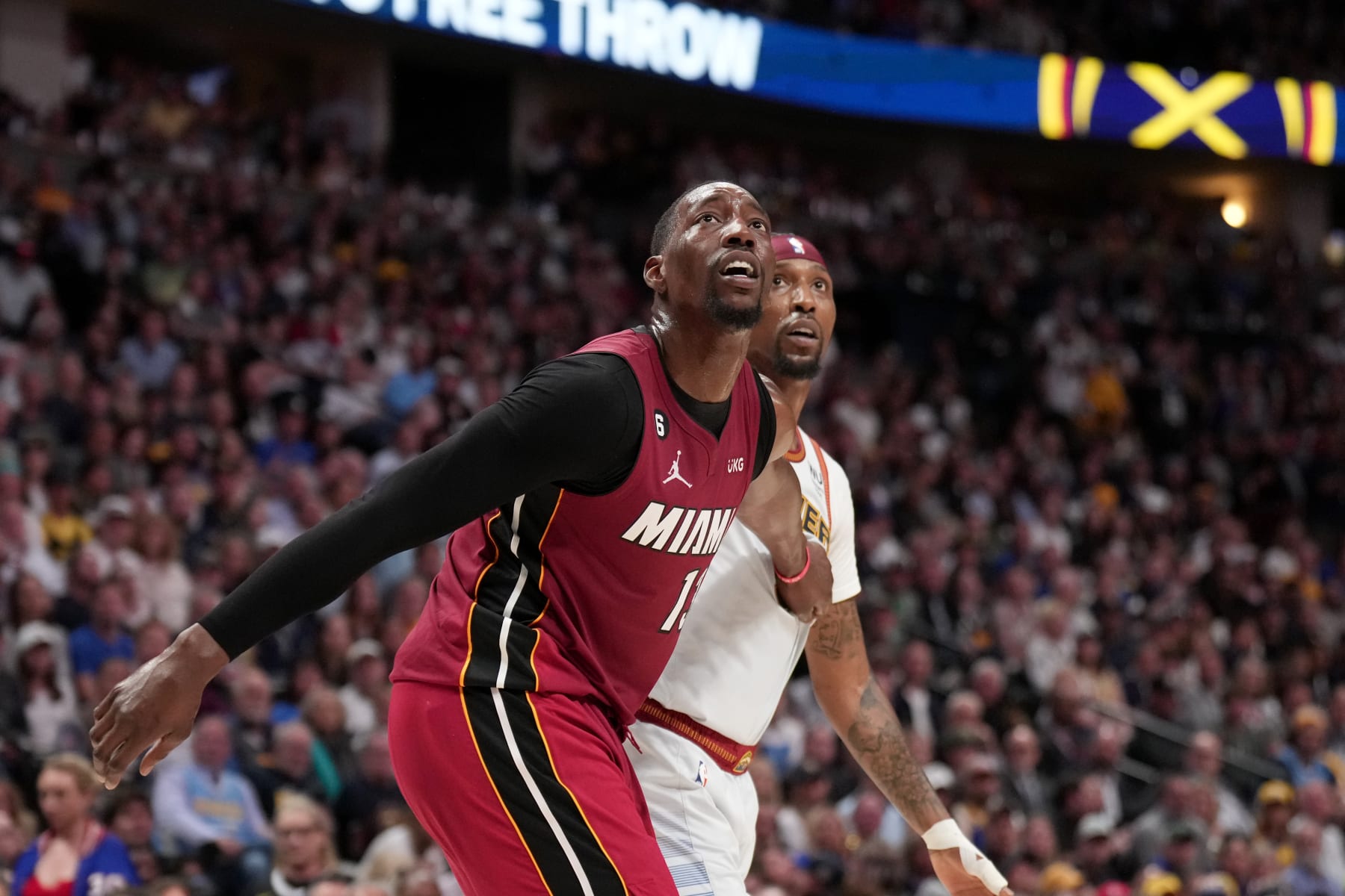 DENVER, CO - JUNE 12: Bam Adebayo #13 of the Miami Heat and Kentavious Caldwell-Pope #5 of the Denver Nuggets look on during Game Five of the 2023 NBA Finals on June 12, 2023 at Ball Arena in Denver, Colorado. NOTE TO USER: User expressly acknowledges and agrees that, by downloading and or using this Photograph, user is consenting to the terms and conditions of the Getty Images License Agreement. Mandatory Copyright Notice: Copyright 2023 NBAE (Photo by Jesse D. Garrabrant/NBAE via Getty Images)