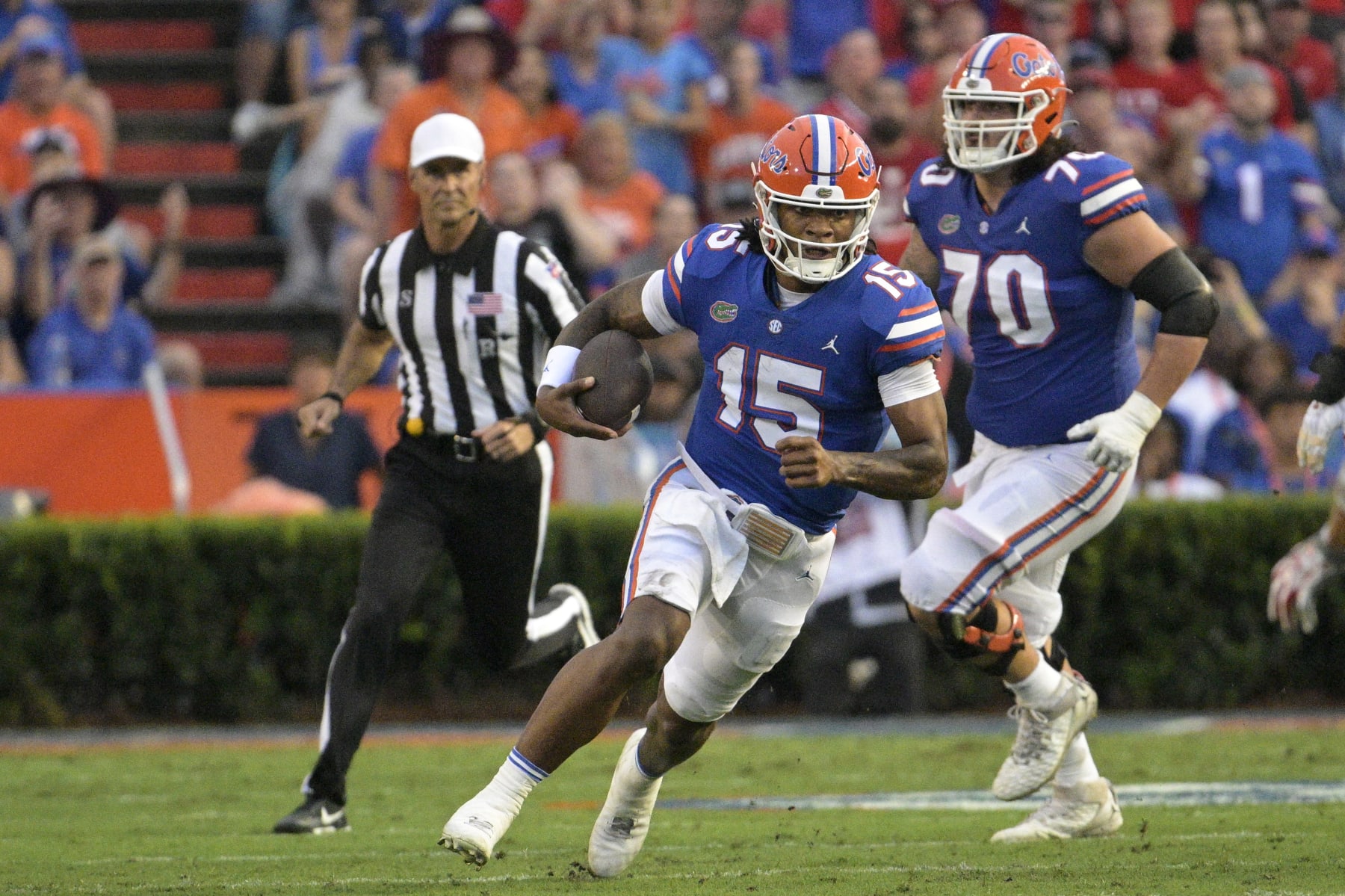 Florida quarterback Anthony Richardson (15) scrambles for yardage during the first half of an NCAA college football game against Utah, Saturday, Sept. 3, 2022, in Gainesville, Fla. (AP Photo/Phelan M. Ebenhack)
