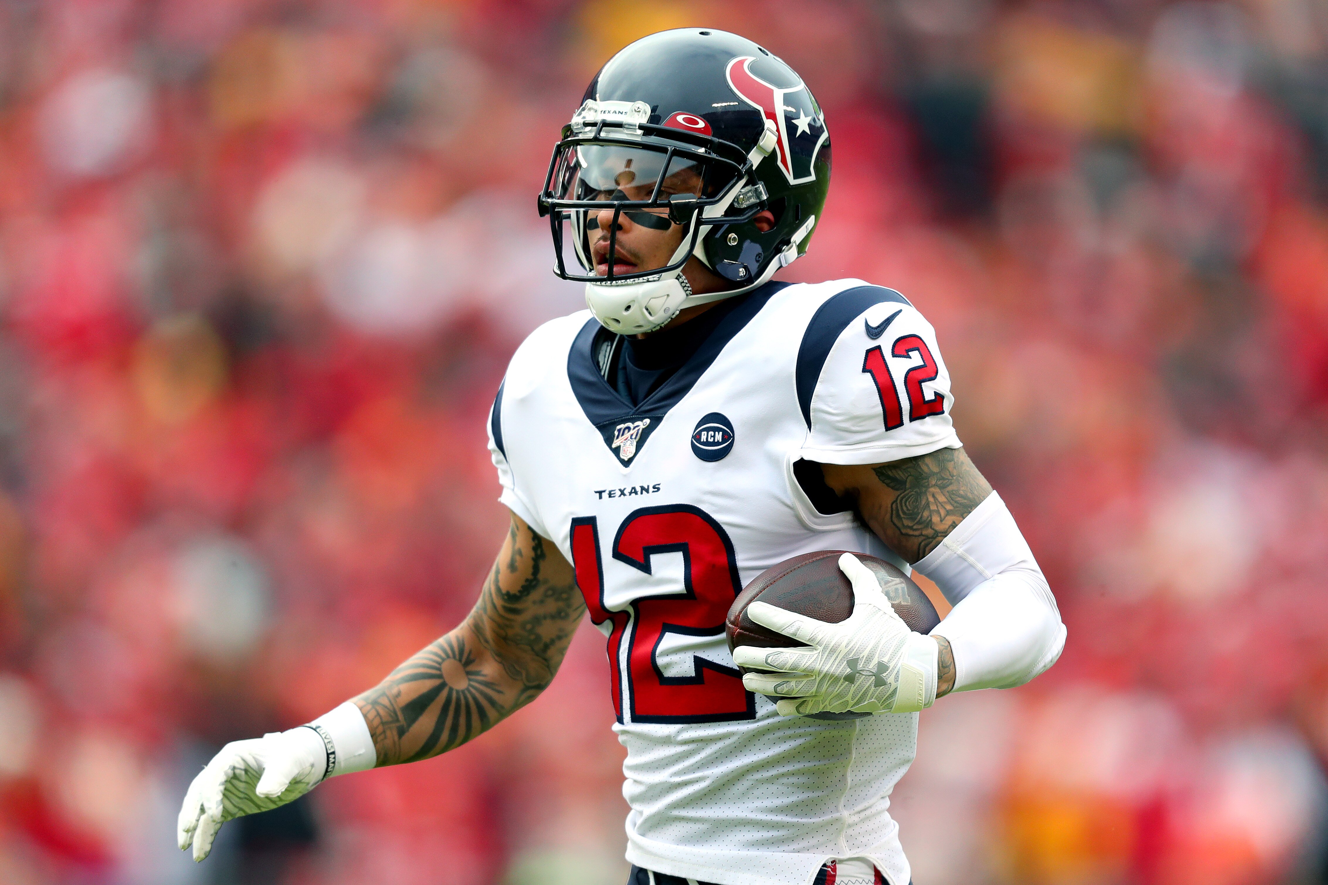 KANSAS CITY, MISSOURI - JANUARY 12:  Kenny Stills #12 of the Houston Texans catches a 54-yard touchdown reception during the first quarter against the Kansas City Chiefs in the AFC Divisional playoff game at Arrowhead Stadium on January 12, 2020 in Kansas City, Missouri. (Photo by Tom Pennington/Getty Images)