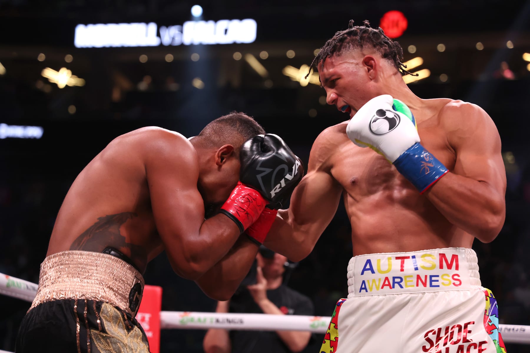 LAS VEGAS, NEVADA - APRIL 22: David Morrell, Jr. in the white and multi-color trunks punches Yamaguchi Falcao in the black and gold trunks during their super middleweight world championship bout at T-Mobile Arena on April 22, 2023 in Las Vegas, Nevada. (Photo by Al Bello/Getty Images)