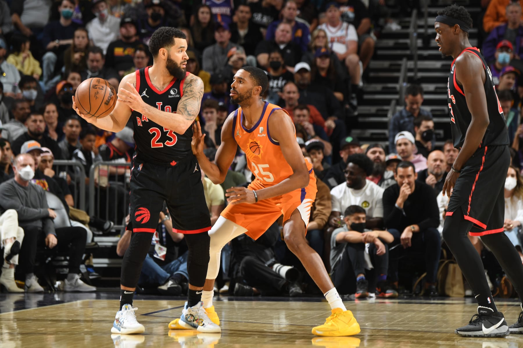 PHOENIX, AZ - MARCH 11: Mikal Bridges #25 of the Phoenix Suns plays defense on Fred VanVleet #23 of the Toronto Raptors during the game on March 11, 2022 at Footprint Center in Phoenix, Arizona. NOTE TO USER: User expressly acknowledges and agrees that, by downloading and or using this photograph, user is consenting to the terms and conditions of the Getty Images License Agreement. Mandatory Copyright Notice: Copyright 2022 NBAE (Photo by Andrew D. Bernstein/NBAE via Getty Images)