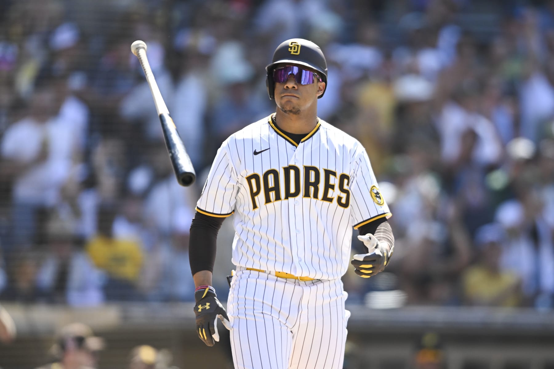 SAN DIEGO, CA - JULY 26:  Juan Soto #22 of the San Diego Padres flips his bat after walking during the ninth inning of a baseball game against the Pittsburgh Pirates July 26, 2023 at Petco Park in San Diego, California. (Photo by Denis Poroy/Getty Images)