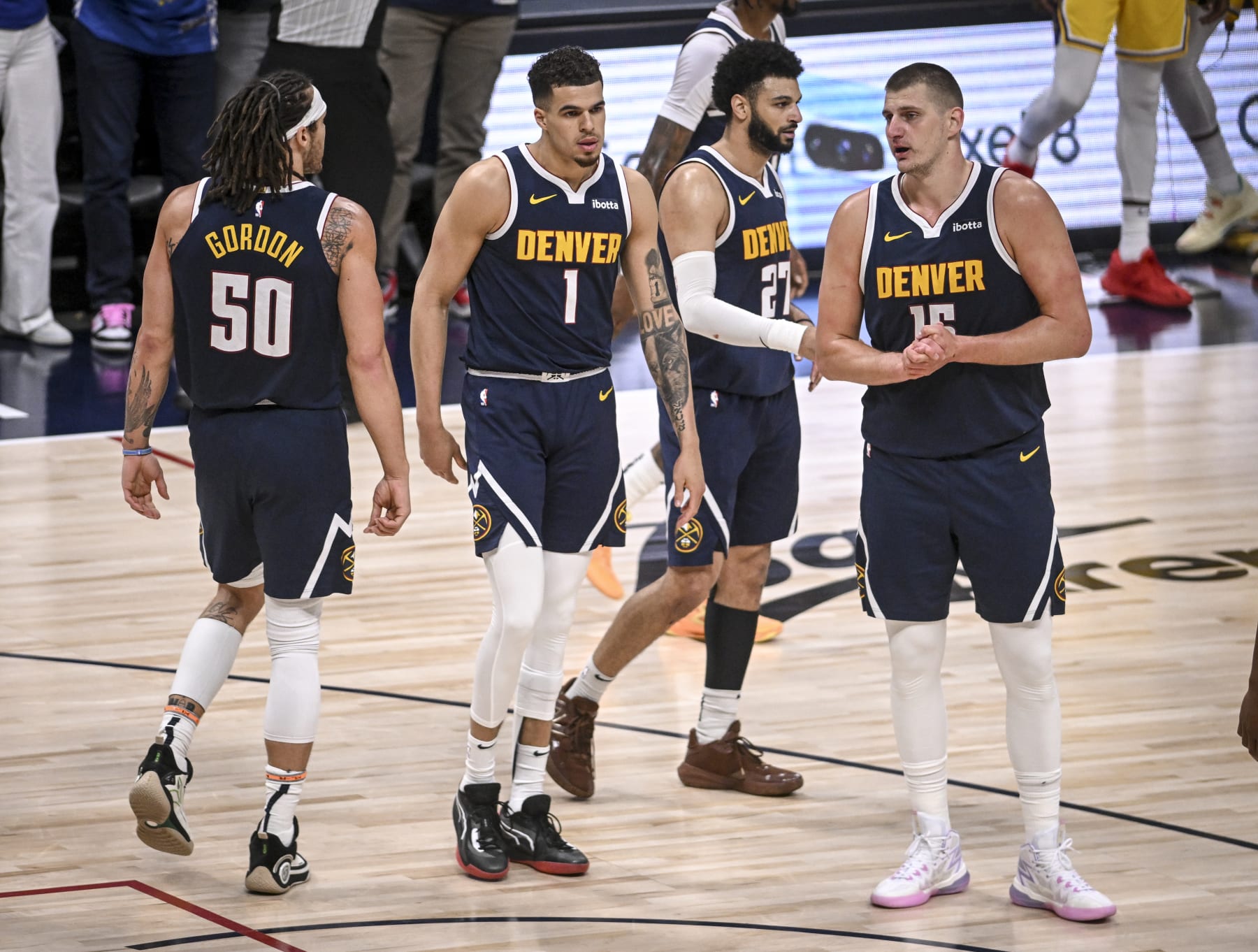 DENVER, CO - APRIL 29: Michael Porter Jr. (1) of the Denver Nuggets celebrates drawing a shooting foul, while making a three pointer over Anthony Davis (3) of the Los Angeles Lakers with teammates Aaron Gordon (50), Nikola Jokic (15) and Jamal Murray (27) during the third quarter at Ball Arena in Denver, Colorado on Monday, April 29, 2024. (Photo by AAron Ontiveroz/The Denver Post)